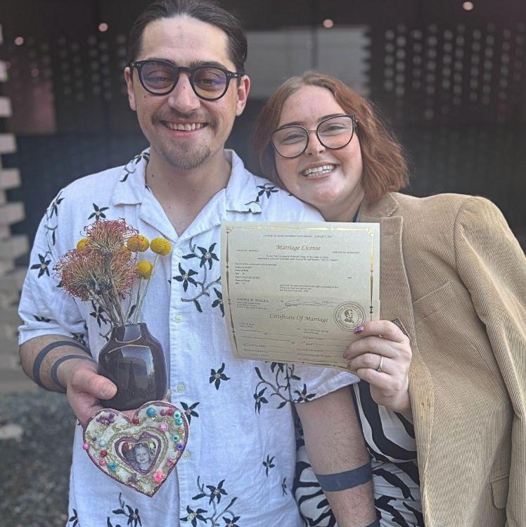 Just outside the courthouse with our fresh marriage license!