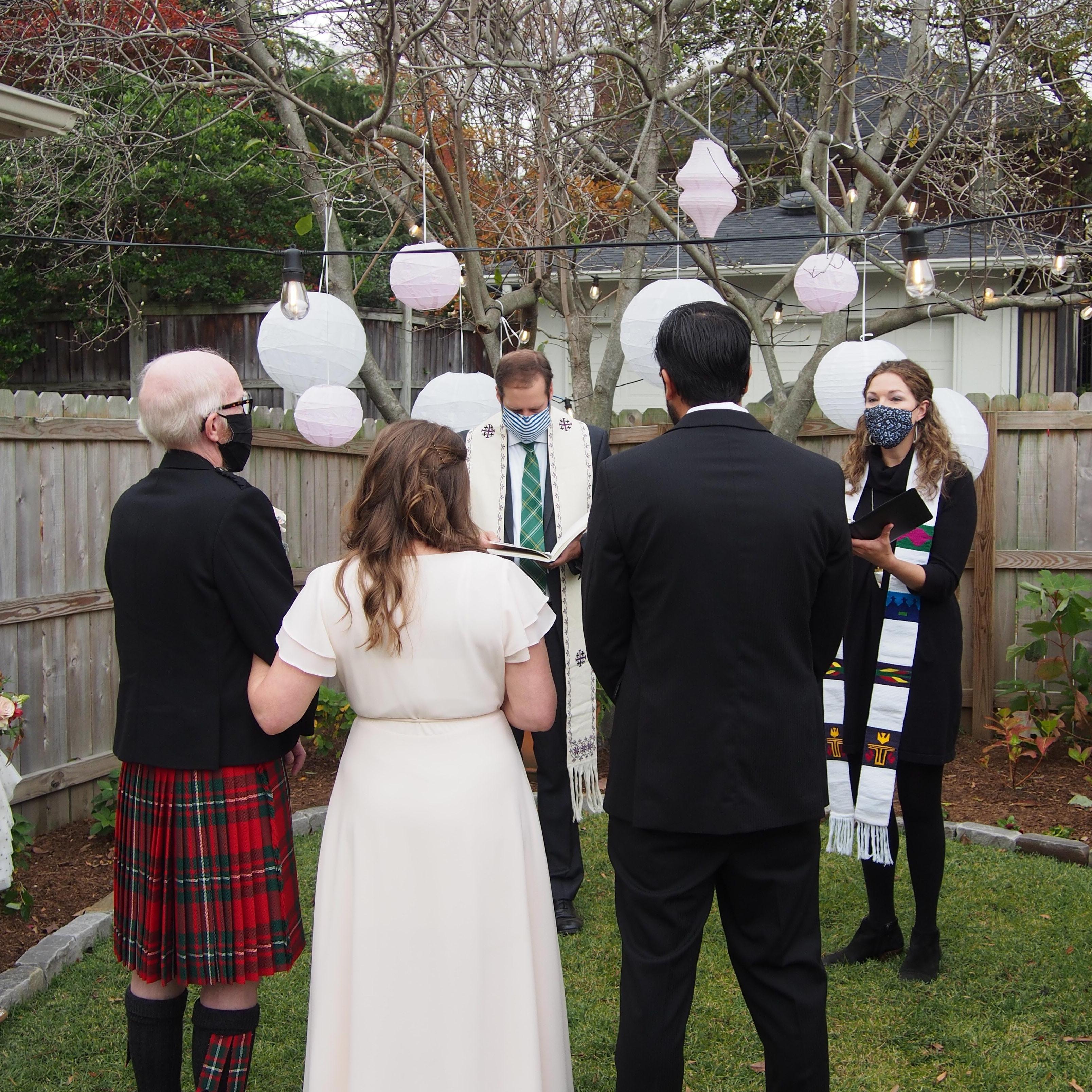 The Reverends Davis and Julie Bailey officiated the Christian backyard ceremony