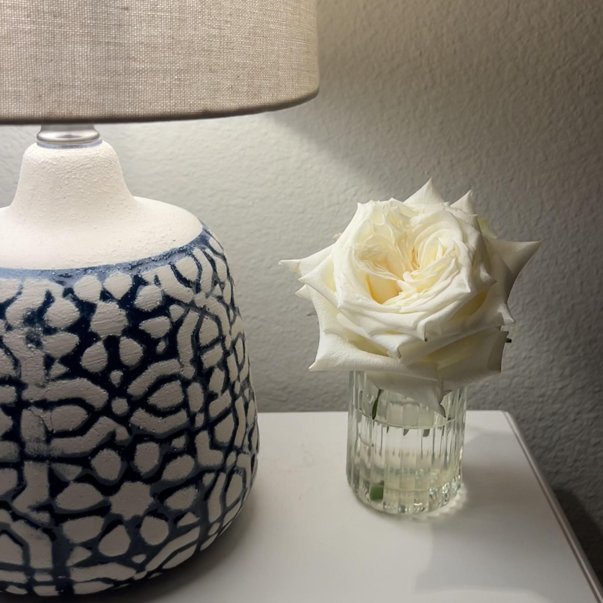 A single stem flower sits at the top of their wedding invitation, just like the first one Jacob gave Yamilet, and the one he still leaves by her bedside as a quiet, daily reminder of his love