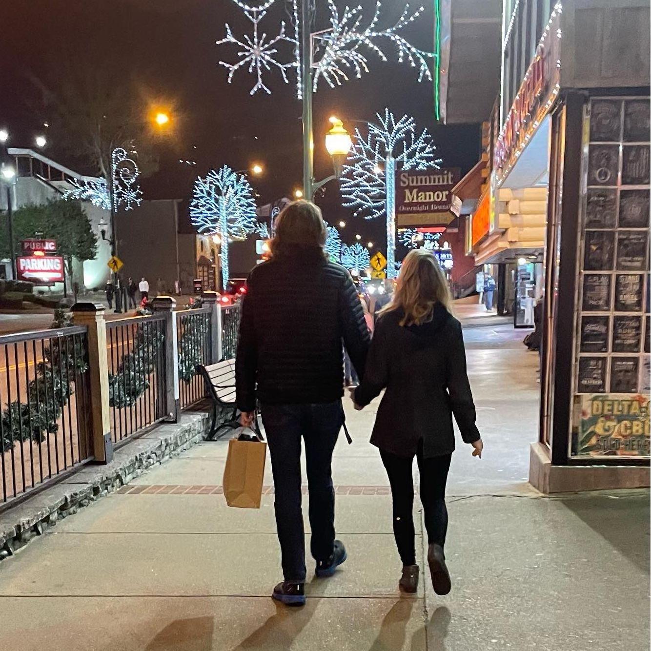 In 2022, we traveled to Gatlinburg with Alex's family for the Holidays. Alex's mother took this pic of us while we were shopping downtown.