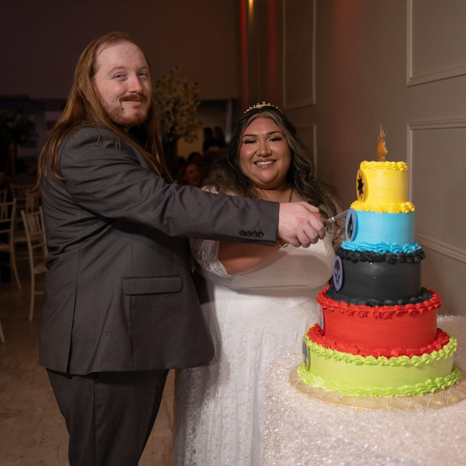 Bride and groom with our Magic: The Gathering themed wedding cake.