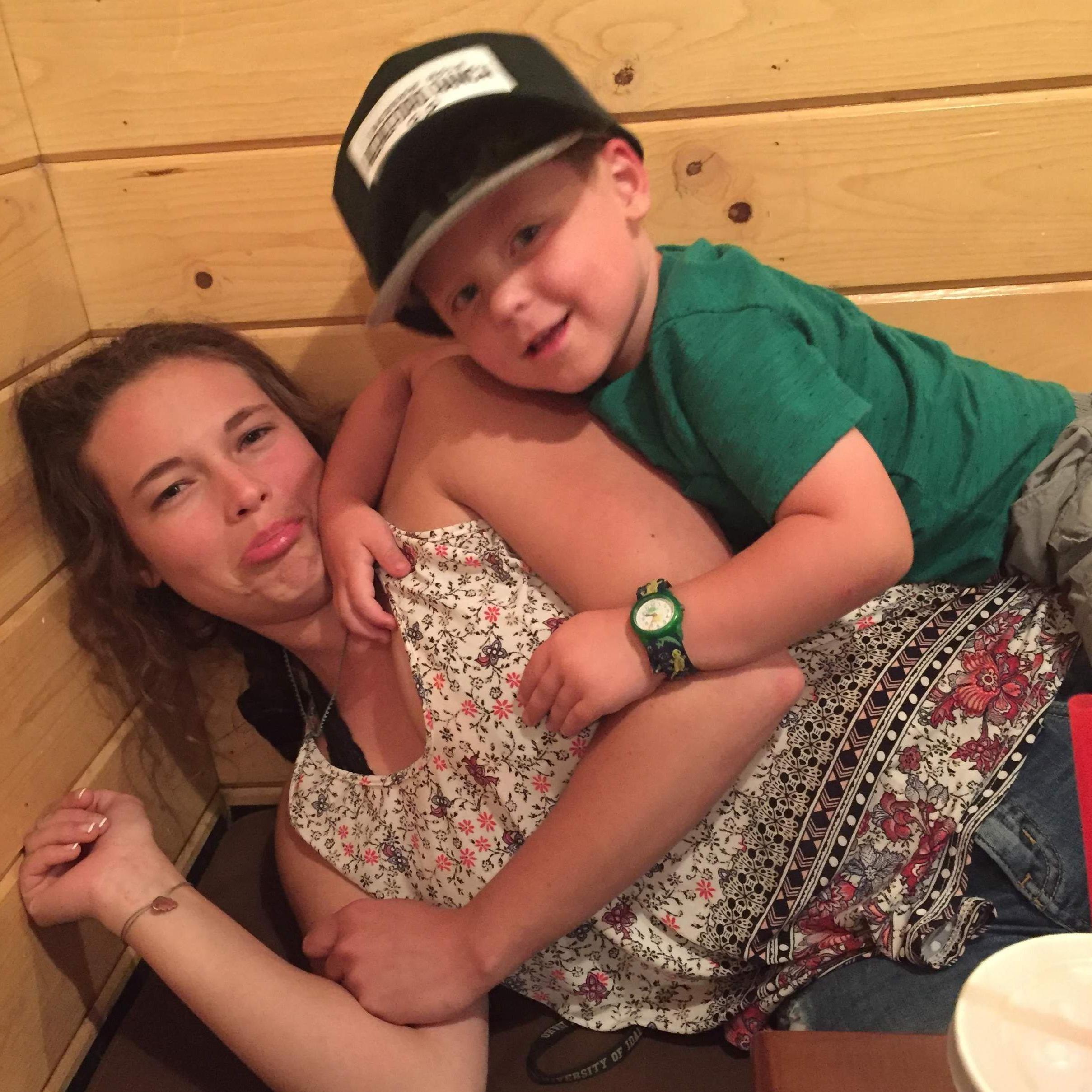 Auntie Em and Pax wrestling in a booth💚