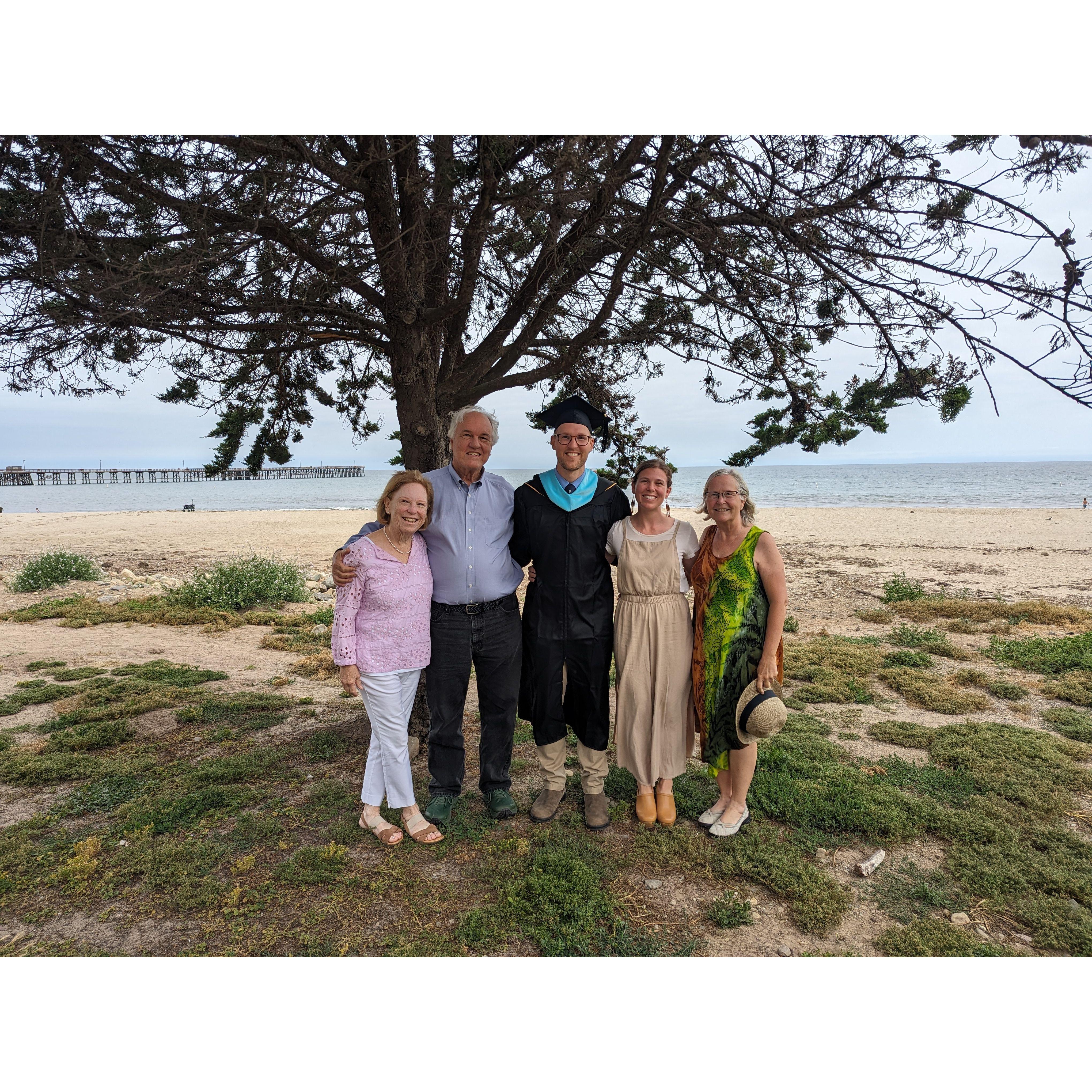 Family coming together to celebrate Phil's graduation from grad school!