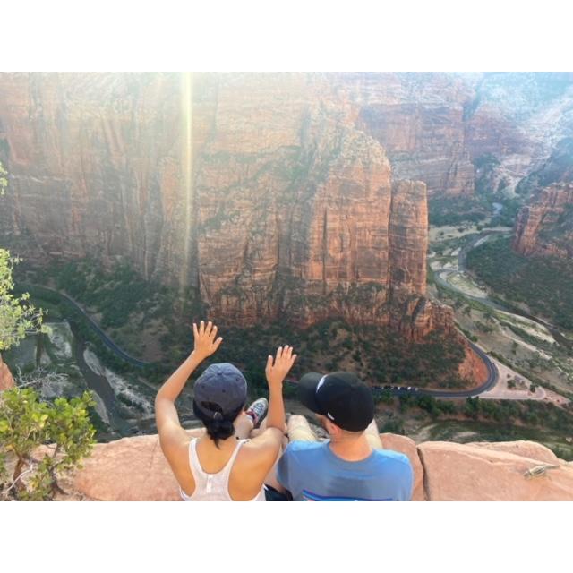 Watching our eyes flash before our eyes on this ledge in Zion.