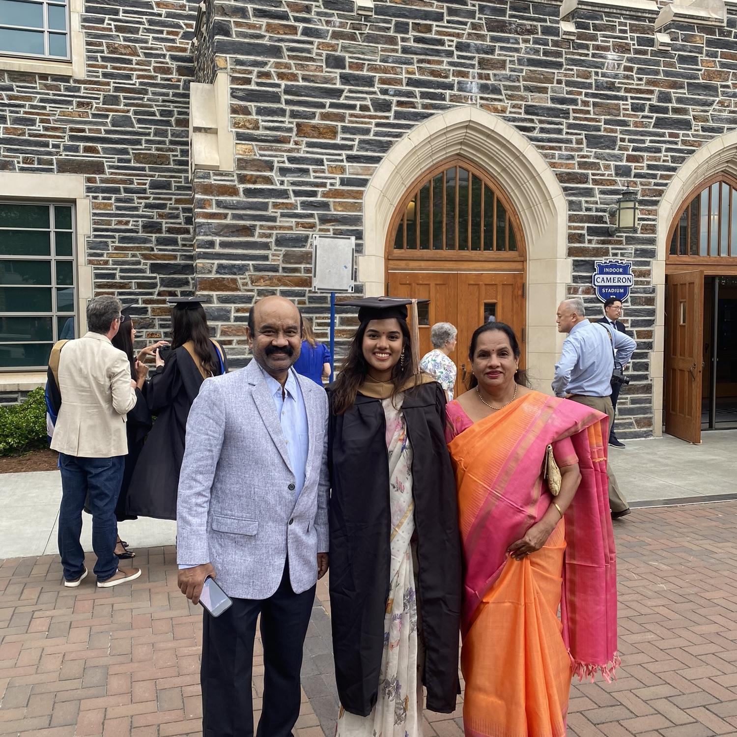 Tag with her parents at graduation