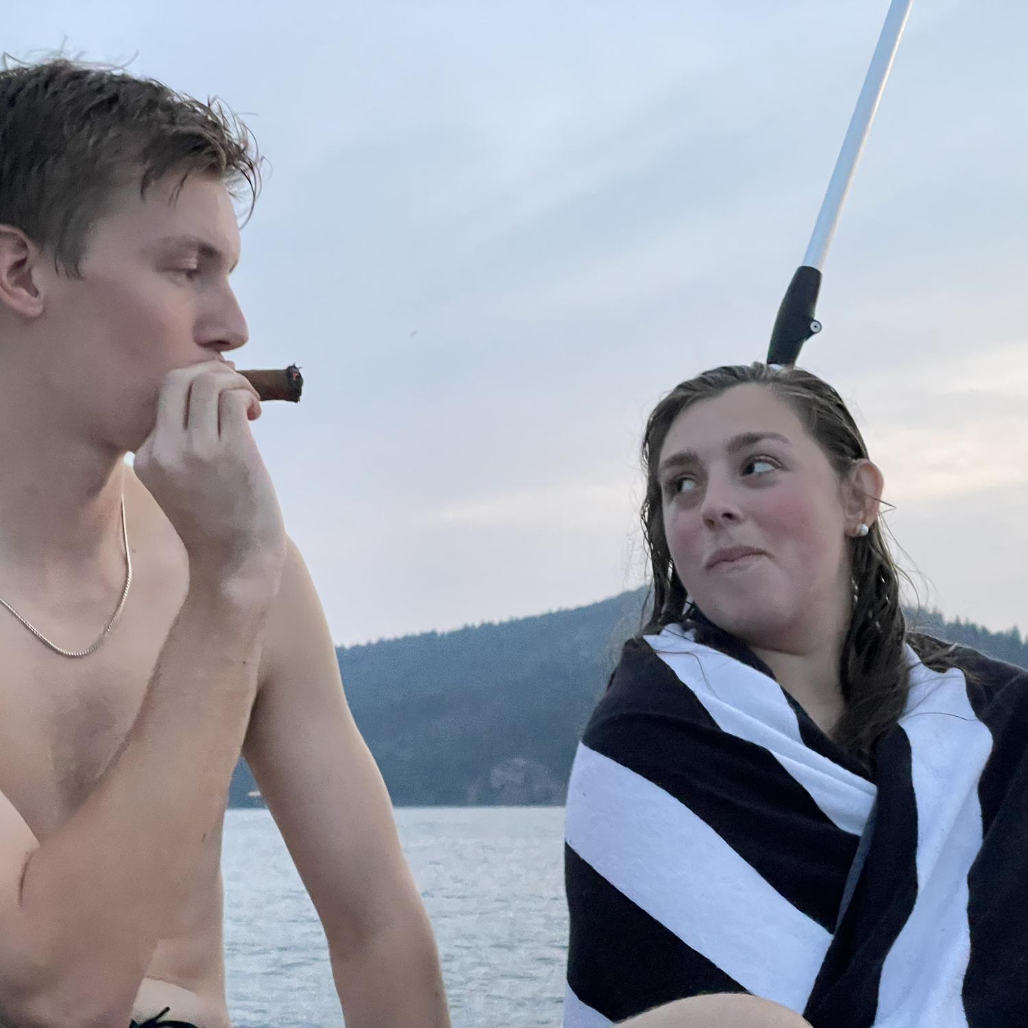 Brice smoking a cigar and Elle not being too happy about it.