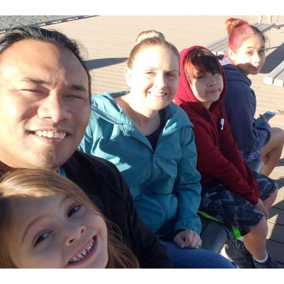 Watching Old Faithful erupt at sunrise in Yellowstone National Park with the kids