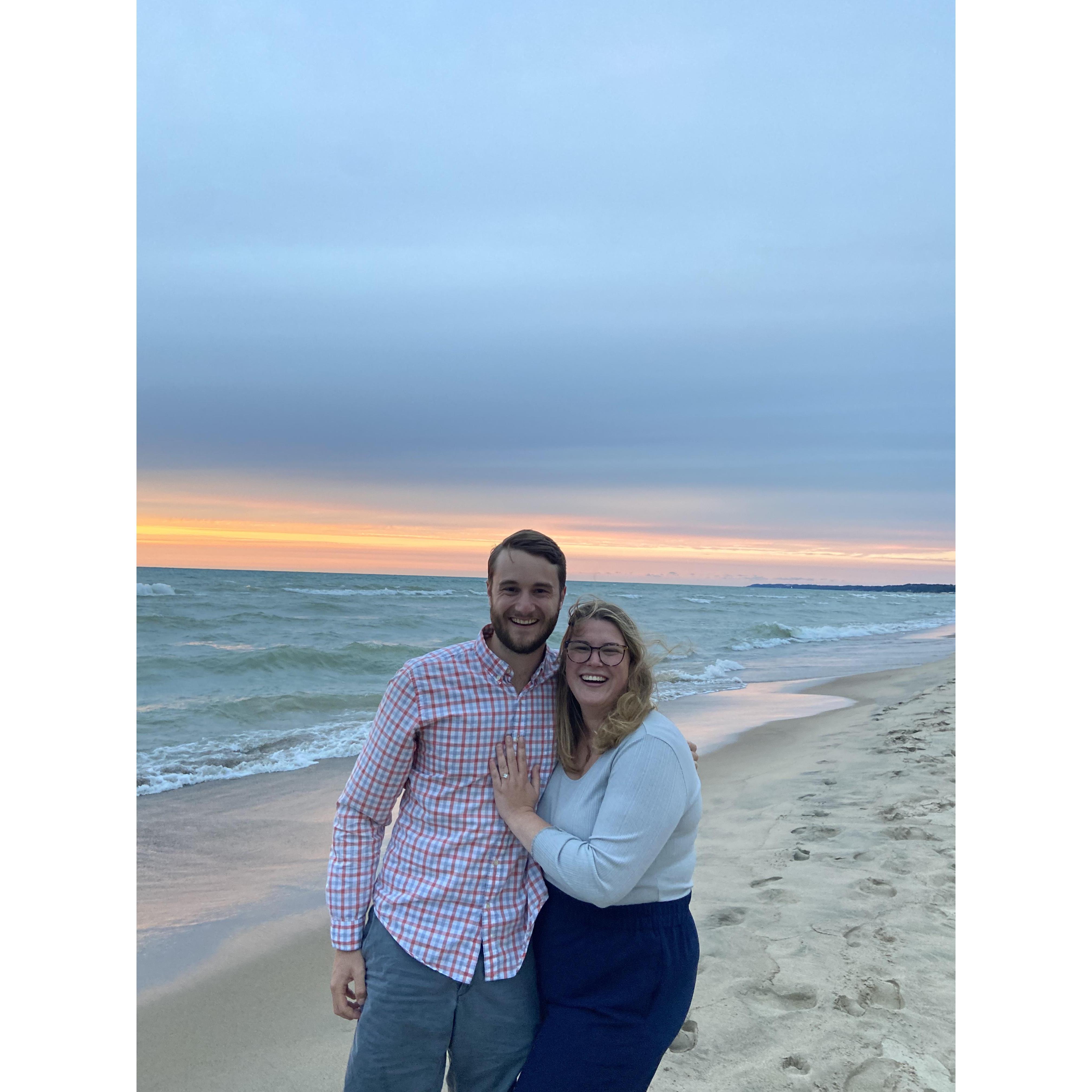 Zach proposed to Emily on his family's beach in Harbert, MI under the sunset...she said yes!