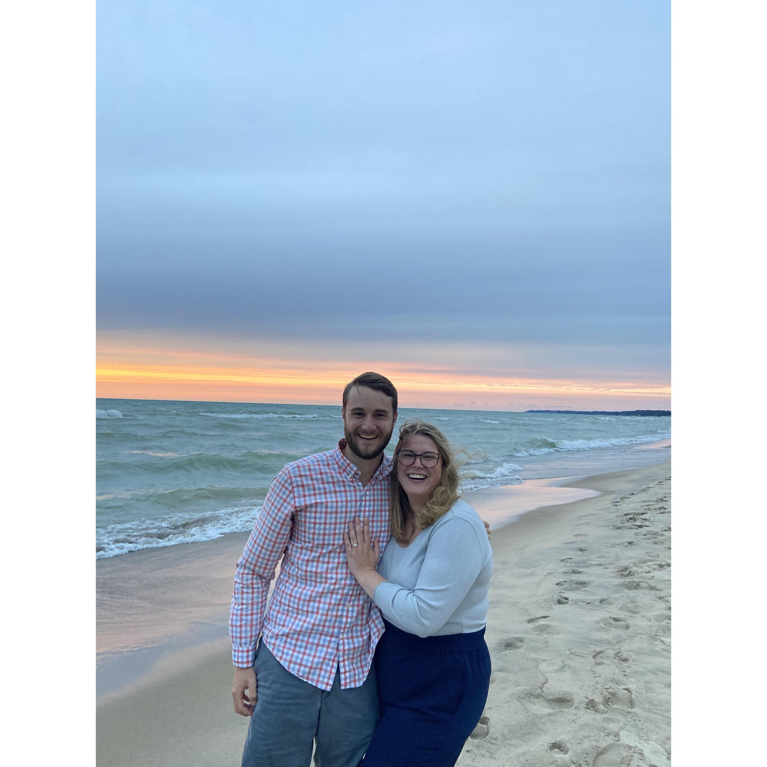 Zach proposed to Emily on his family's beach in Harbert, MI under the sunset...she said yes!