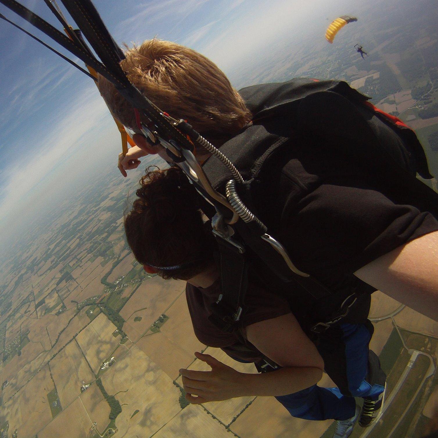 That's Kevin in the background, and Brianna watching him from the canopy of her first tandem jump. This was the first time they spent time together outside of work.