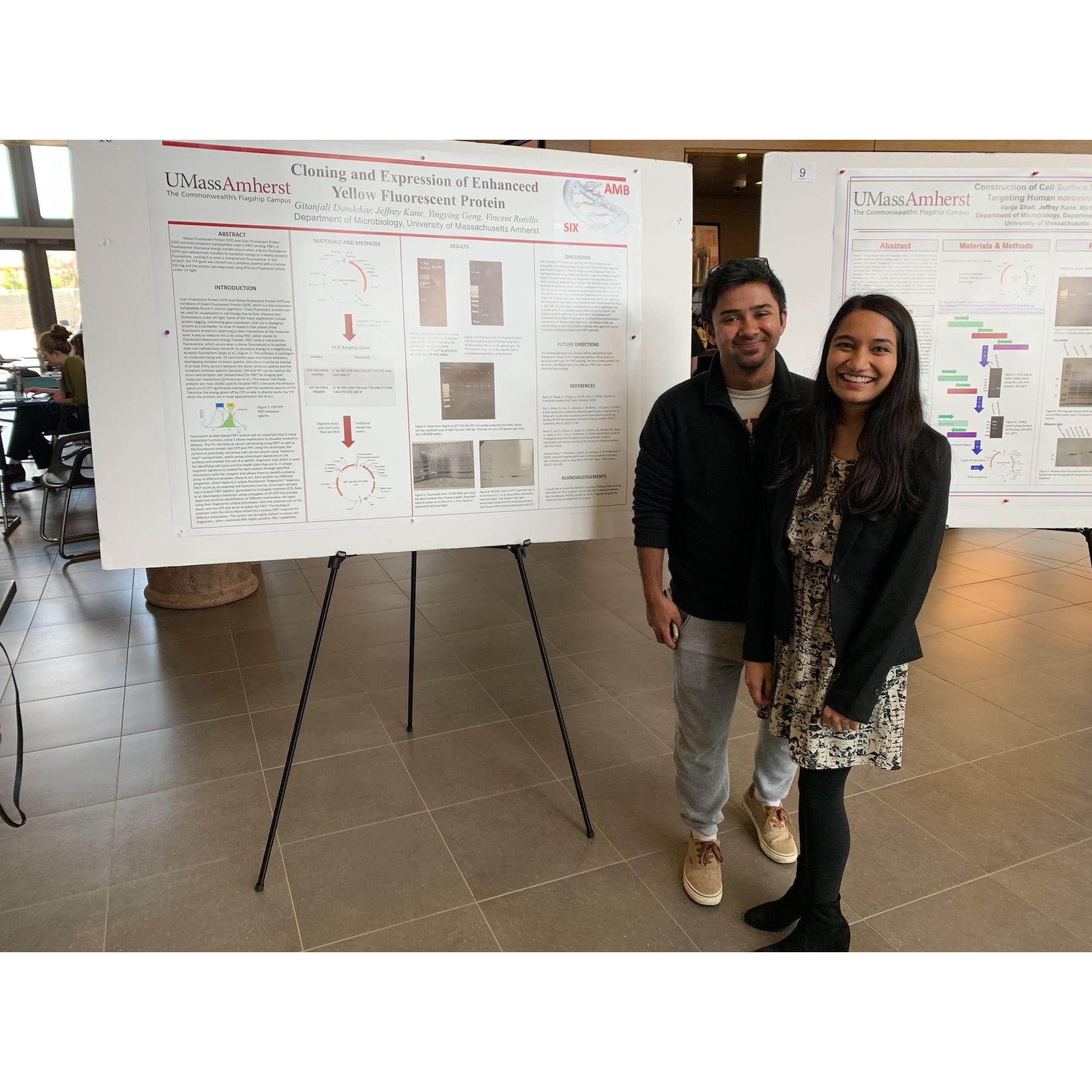 Raiyan supports Gita during her poster session for her Master's Program