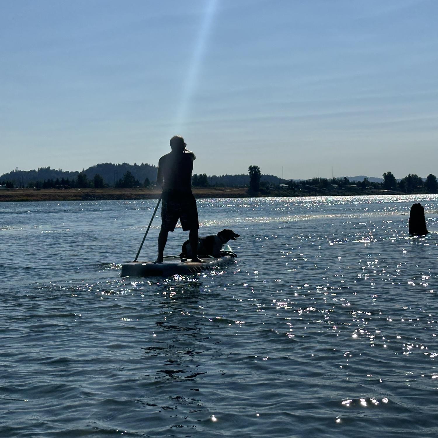 Clint and Penny paddle boarding, August 2024.
