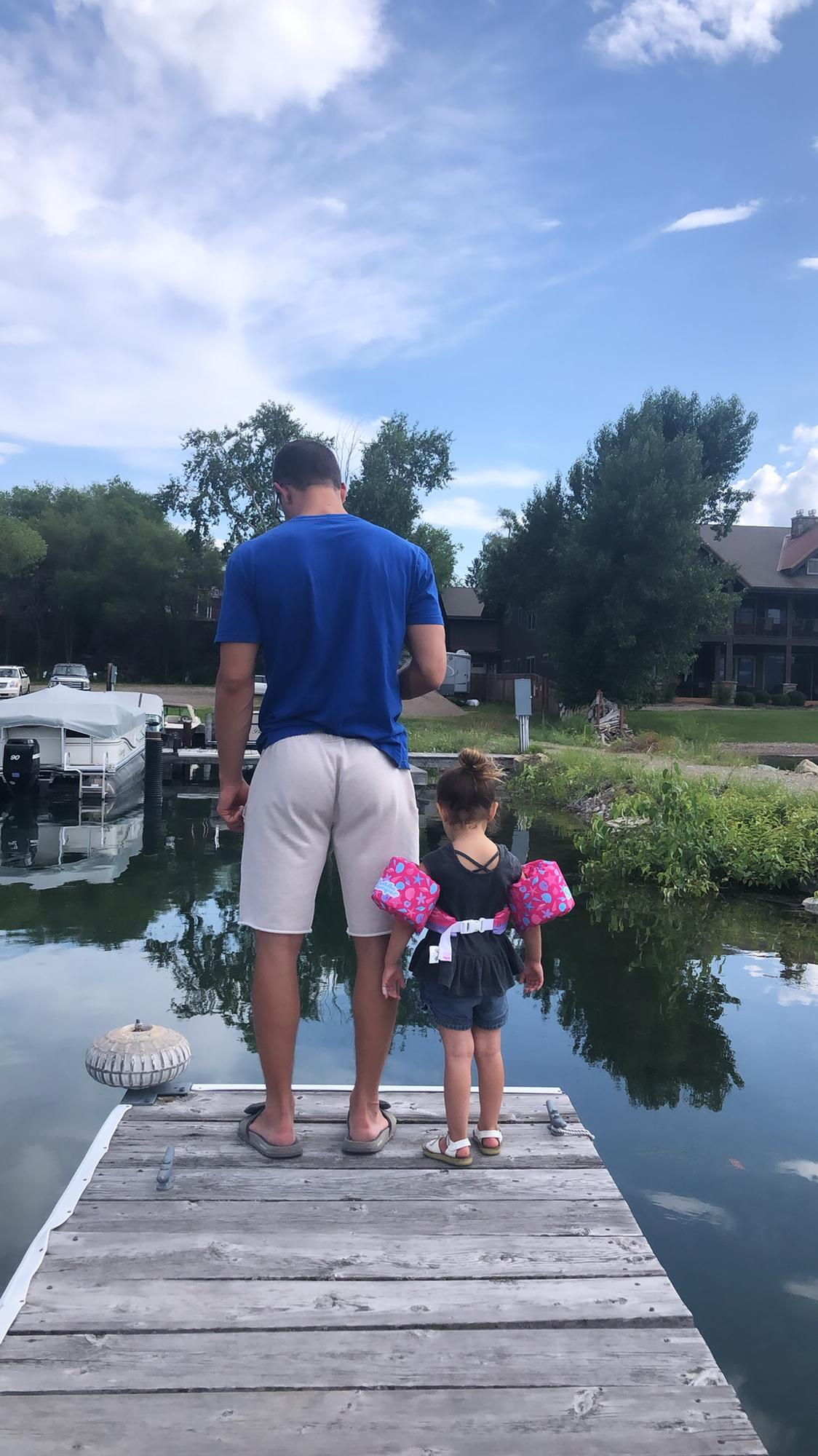 Looking at fish in the lake.