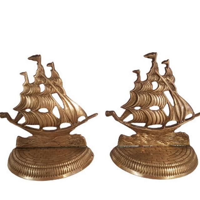 Vintage pair of brass bookends. Bronze figurine of a sailboat.