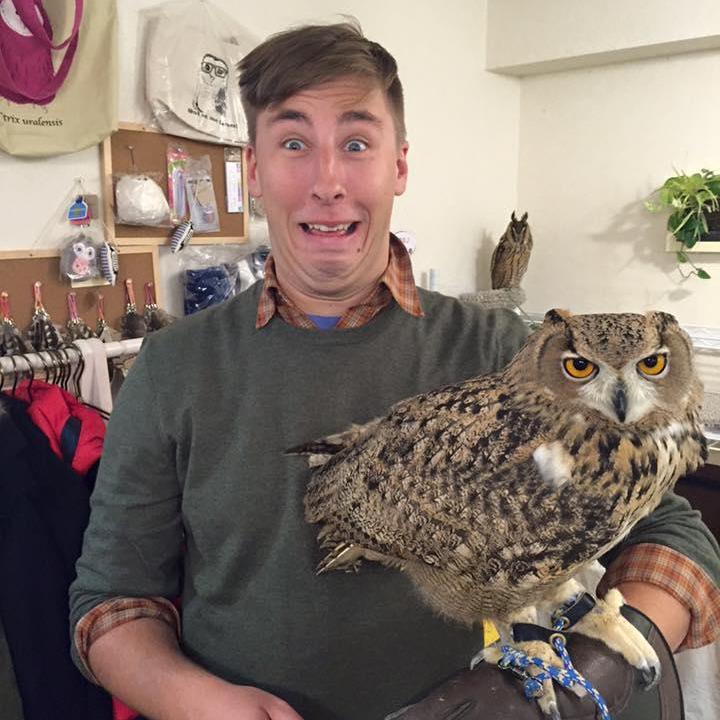 Curtis making new friends at an owl cafe in Tokyo!