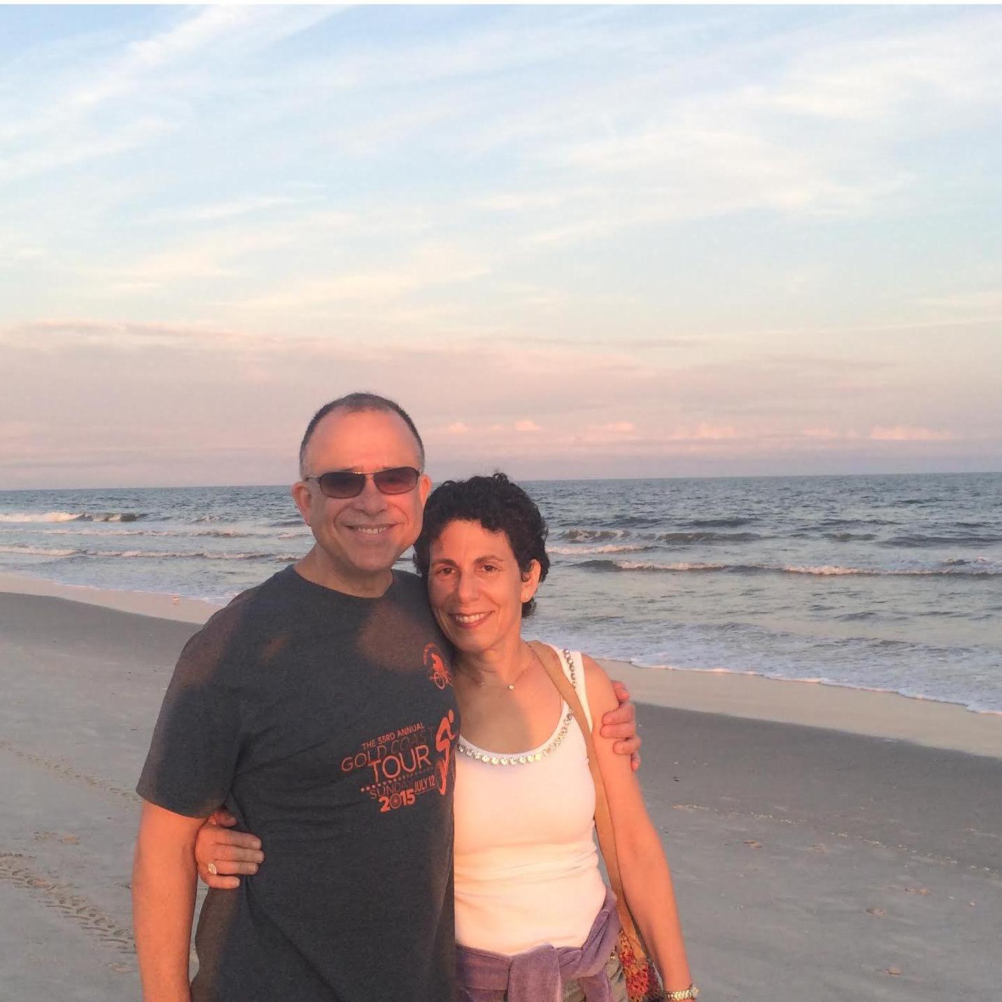 Breanna's parents Susan and Stewart enjoying a walk on the beach at sunset