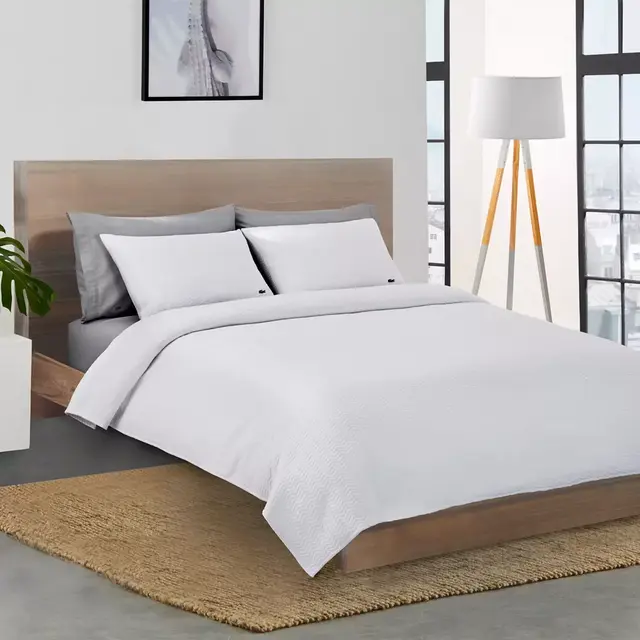 Lacoste™ Chevron Reversible Full/Queen Coverlet in White