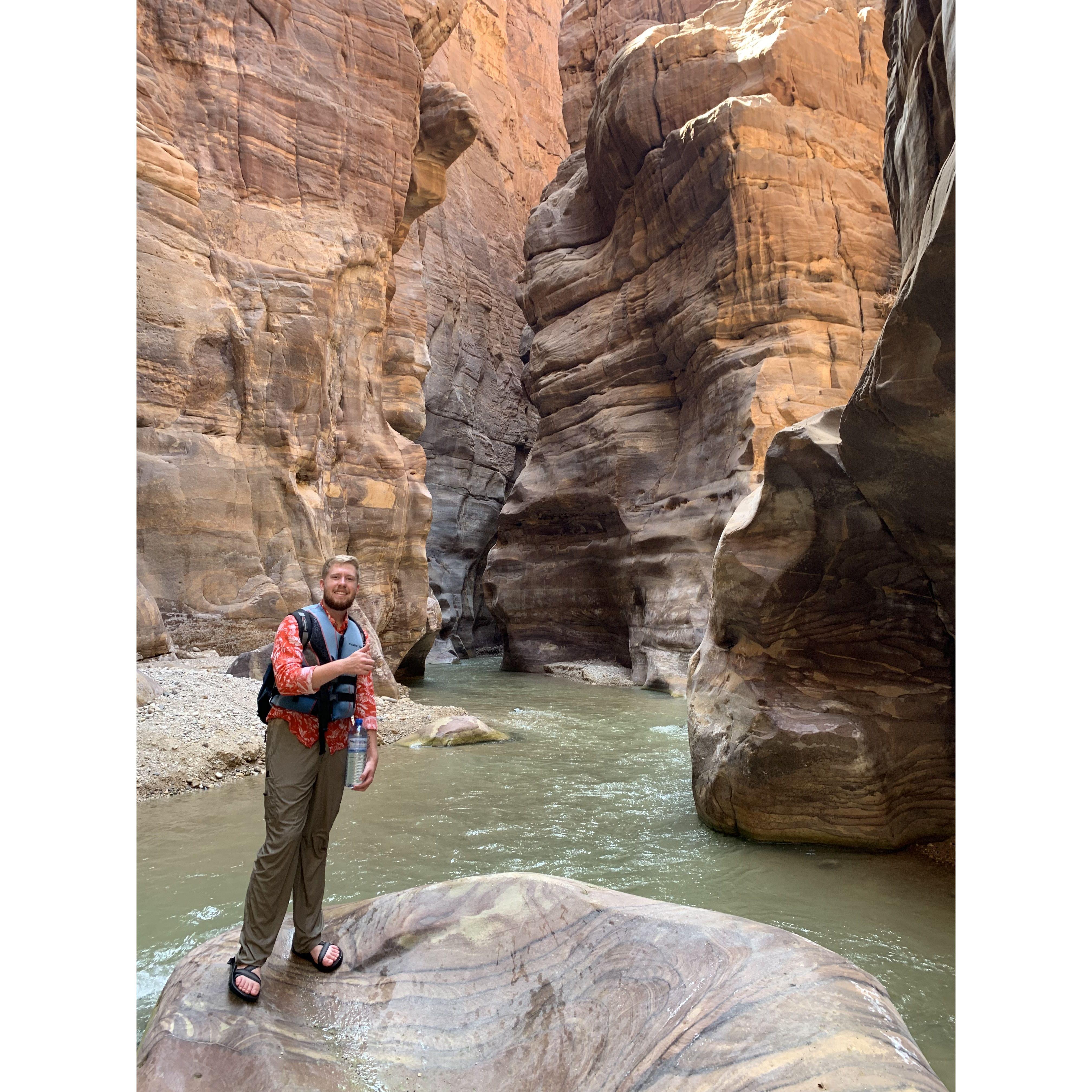 Kyle and I share many things in common - among them are a love for adventure, the outdoors, and other cultures :) This is a photo of Kyle exploring the Wadi Mujib in Jordan. :)