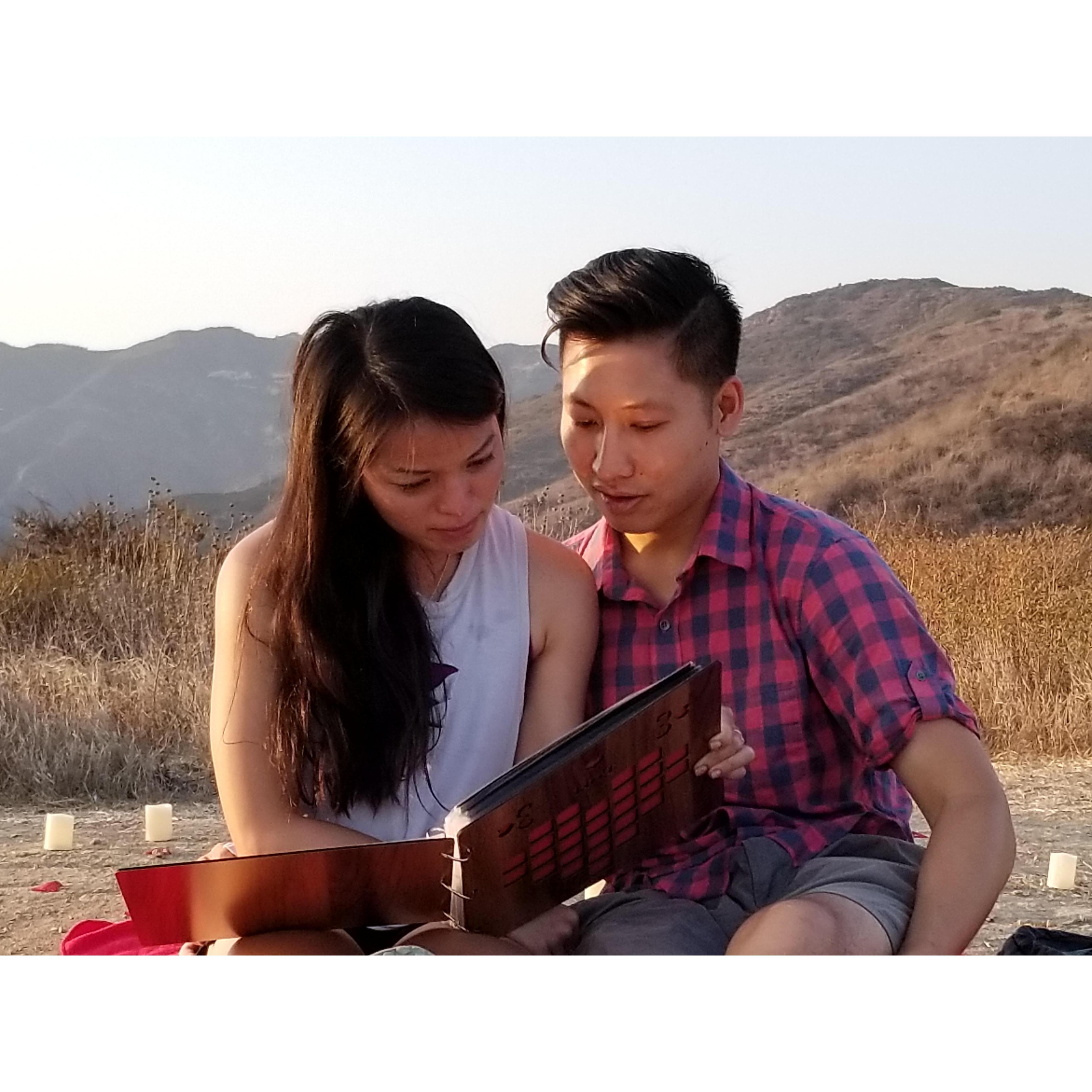 After taking off her blindfold, we are both reading a book of our past memories.