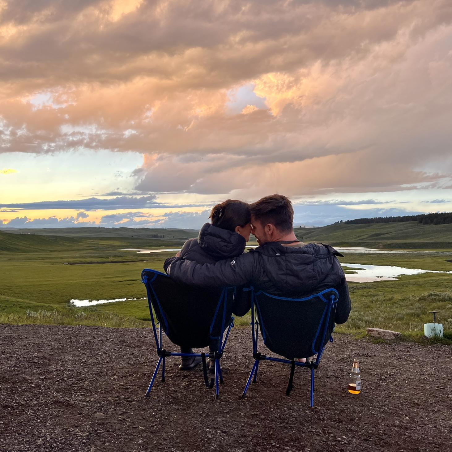 Watching the sunset in Yellowstone just outside of our rented RV at an overlook.
