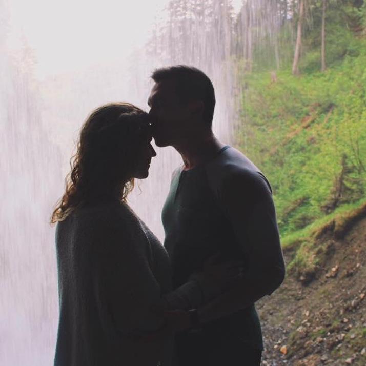 Behind the waterfall of where we got engaged in the Swiss alps.