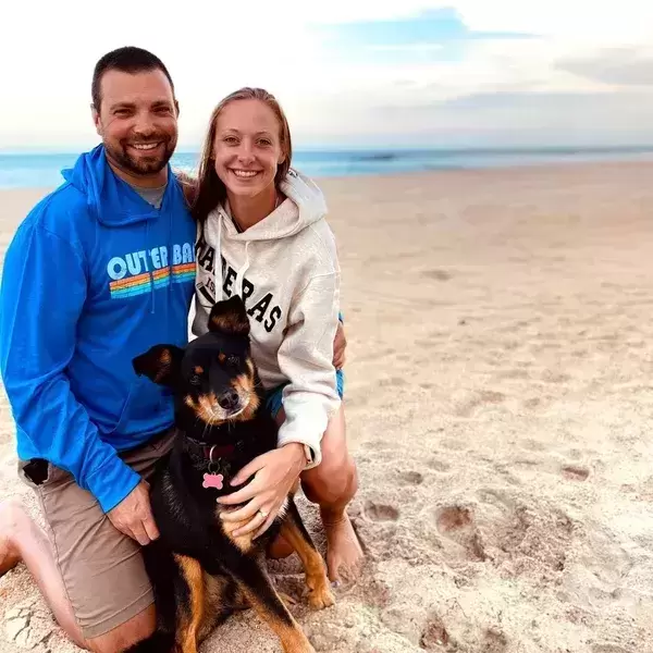 On the beach in the Outer Banks where we got engaged with Simon's dog, Logan.