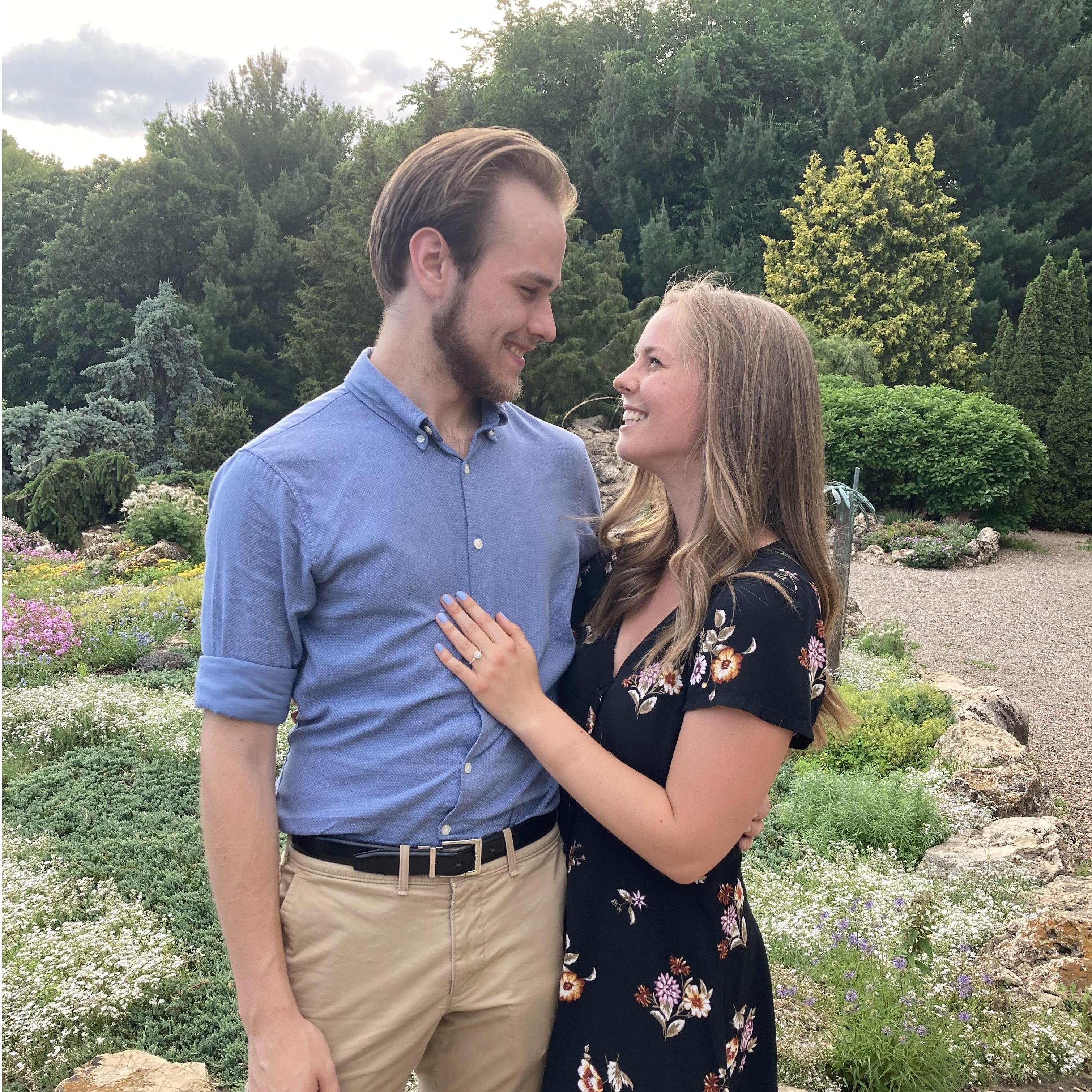 He put a ring on a Ring. ;) 
We are indebted to the lovely photographer, Diana, who took took this picture (among many others) moments after we got engaged!