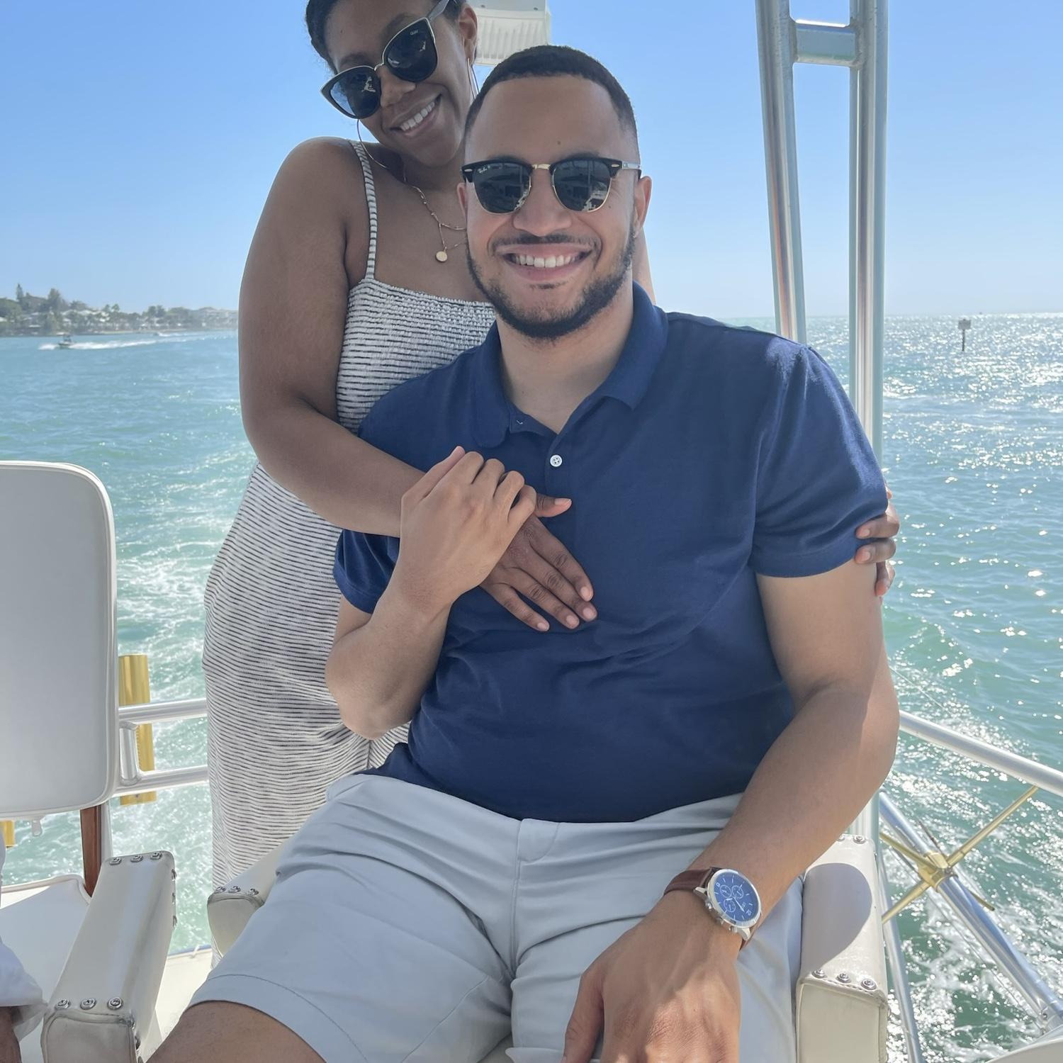 Sarah & Charles on a boat in Tampa, FL, celebrating summer.