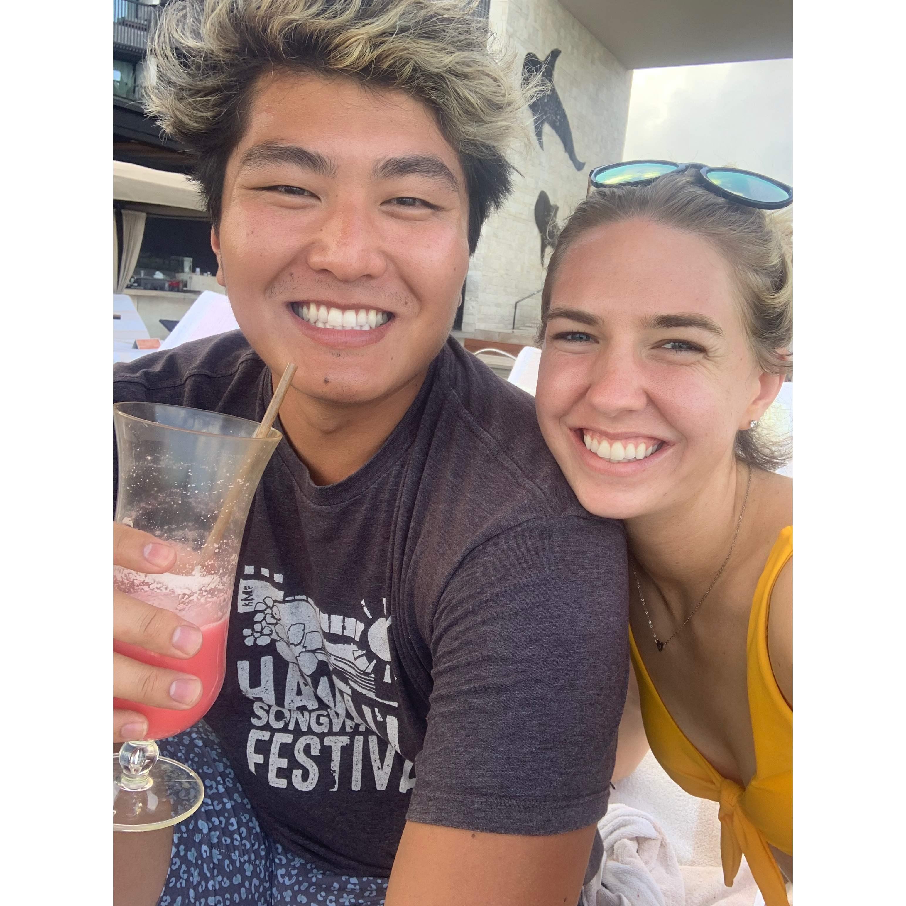 Sipping yummy drinks poolside in Cancun