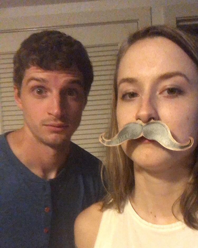 Figuring out who looks better with a mustache...
