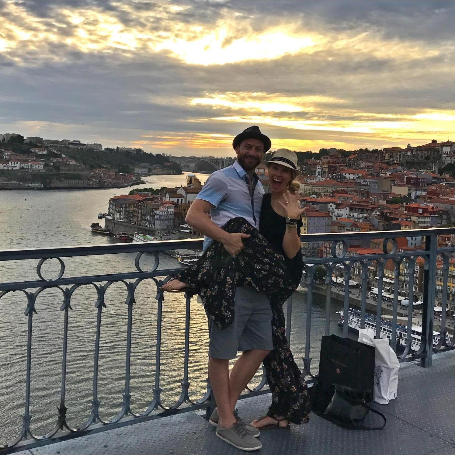 Engaged in Portugal! Taken by a stranger crossing the bridge.