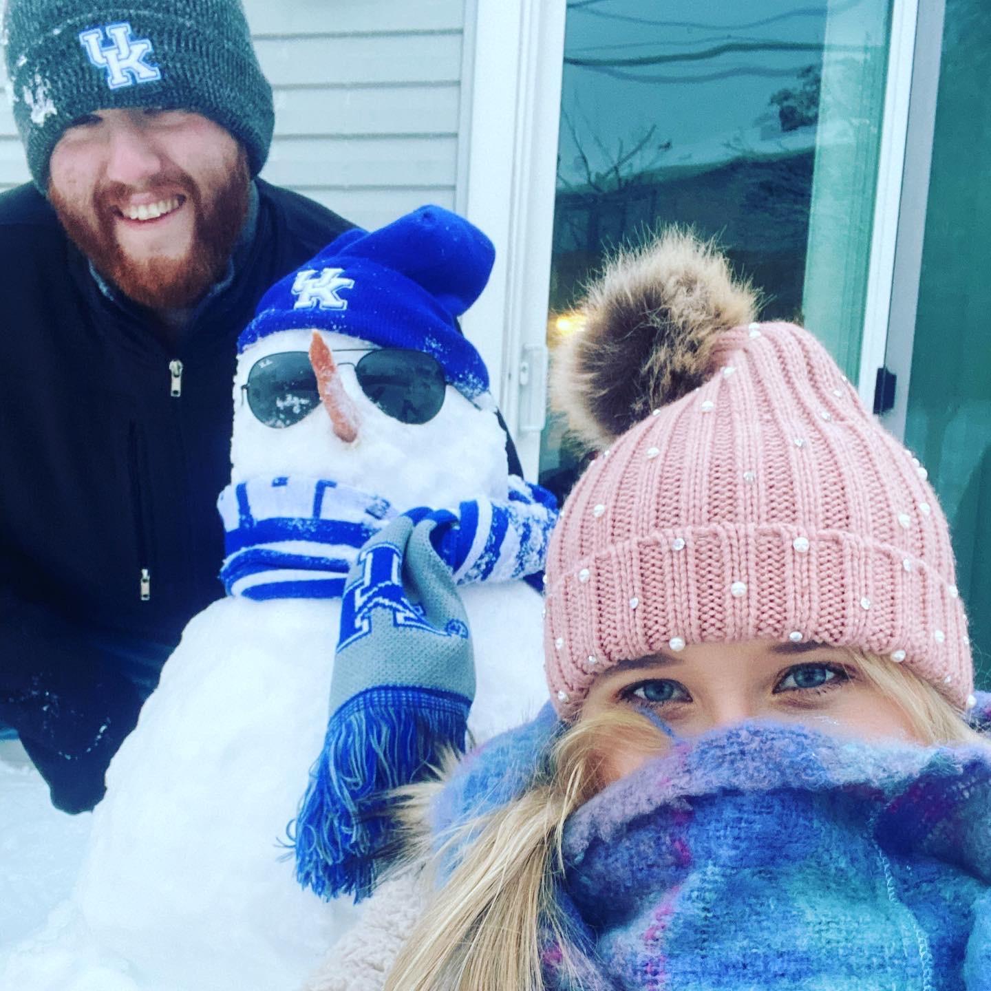 We were so excited to build our first snowman in our first house together! Of course Peaches ate the carrot nose immediately after.