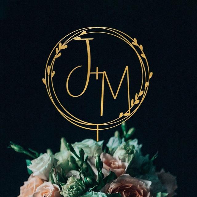 Gold monogram wedding cake topper...