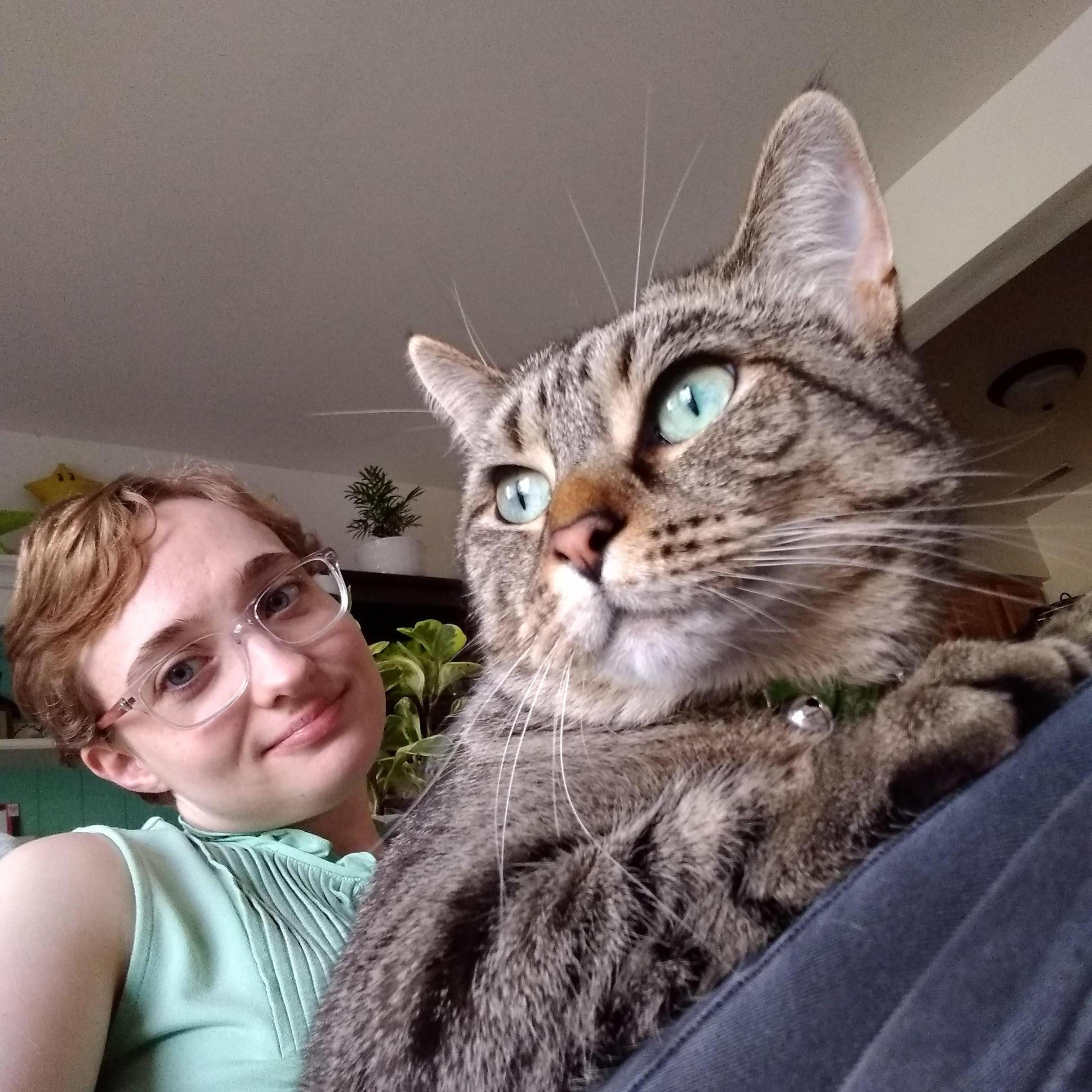 6.8.2021 - Belleville, MI
Relaxing with our cat Tama as she birdwatches out the apartment window.