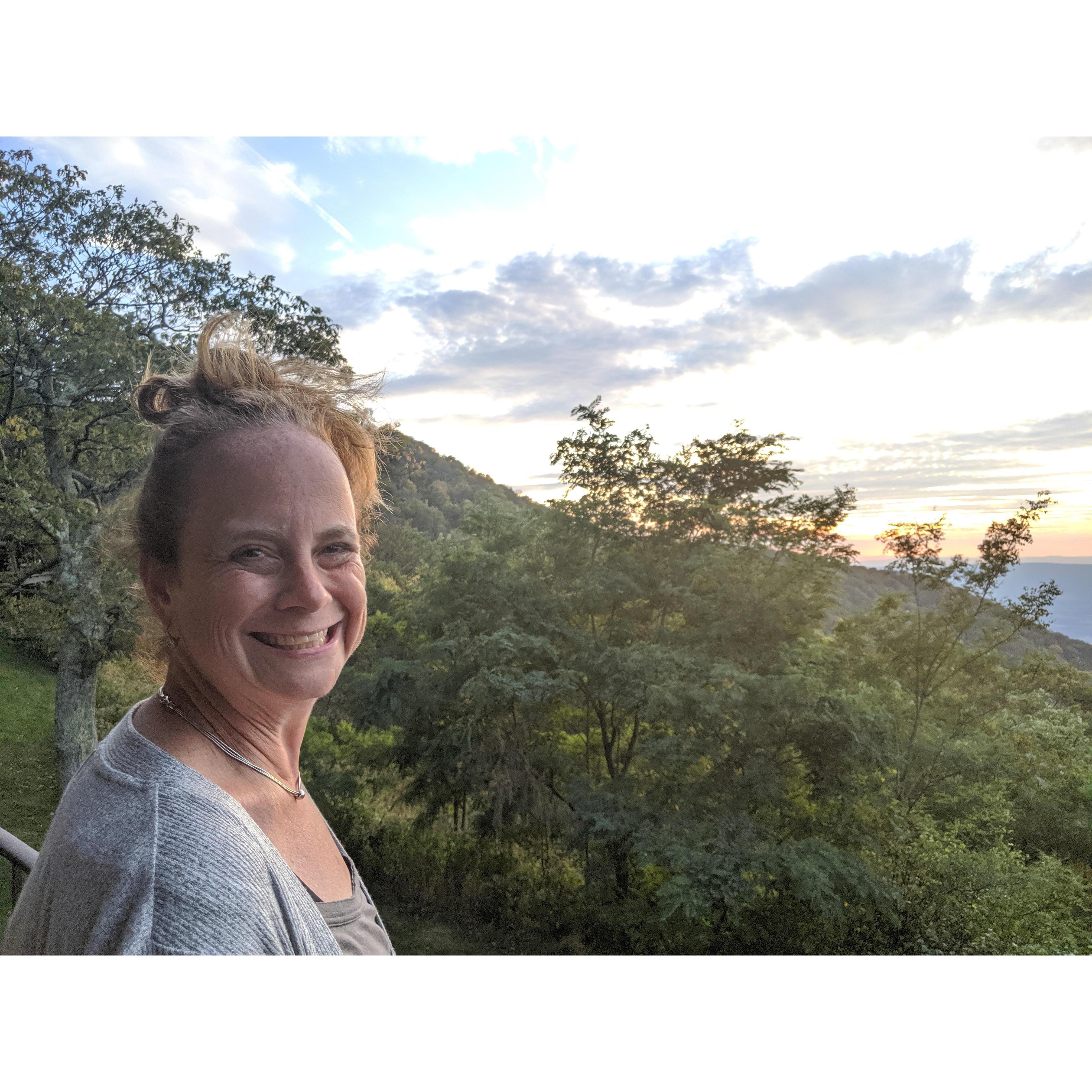 Monica enjoying her view from our balcony for her birthday in Shenandoah national park in 2019.