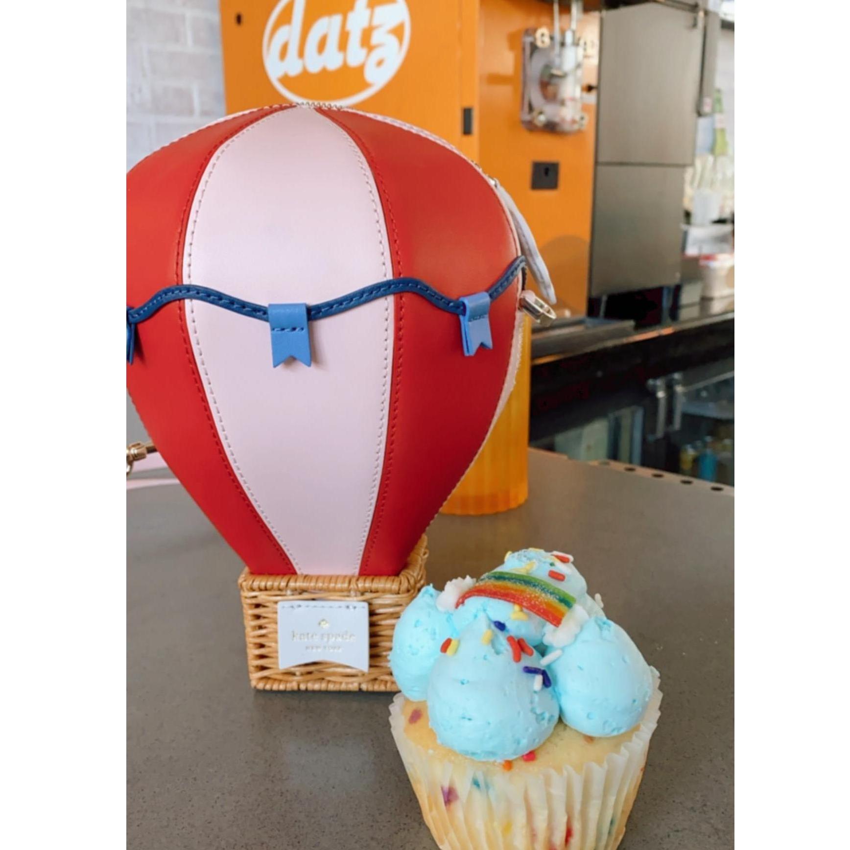 Kasey sent Christie a hot air balloon purse before the wedding.