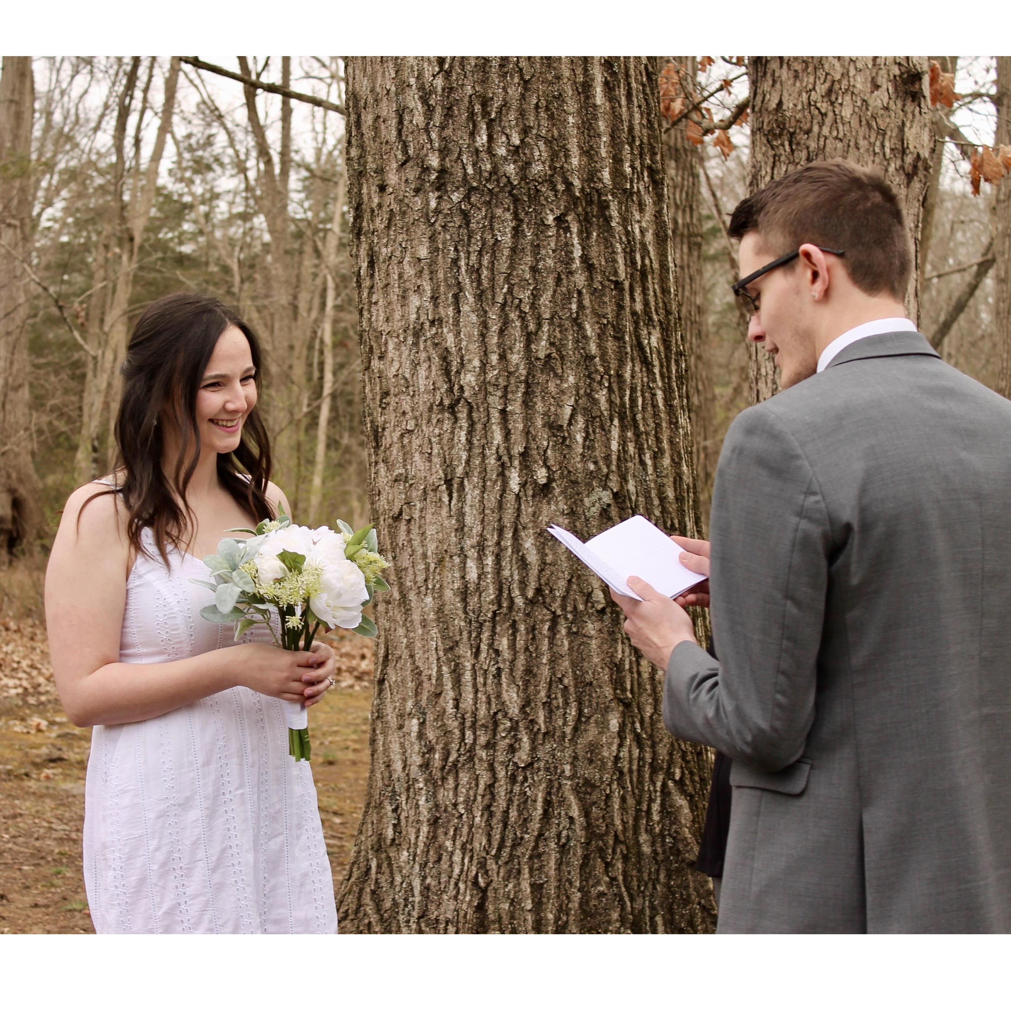 Evan reading his vows to Alyssa.