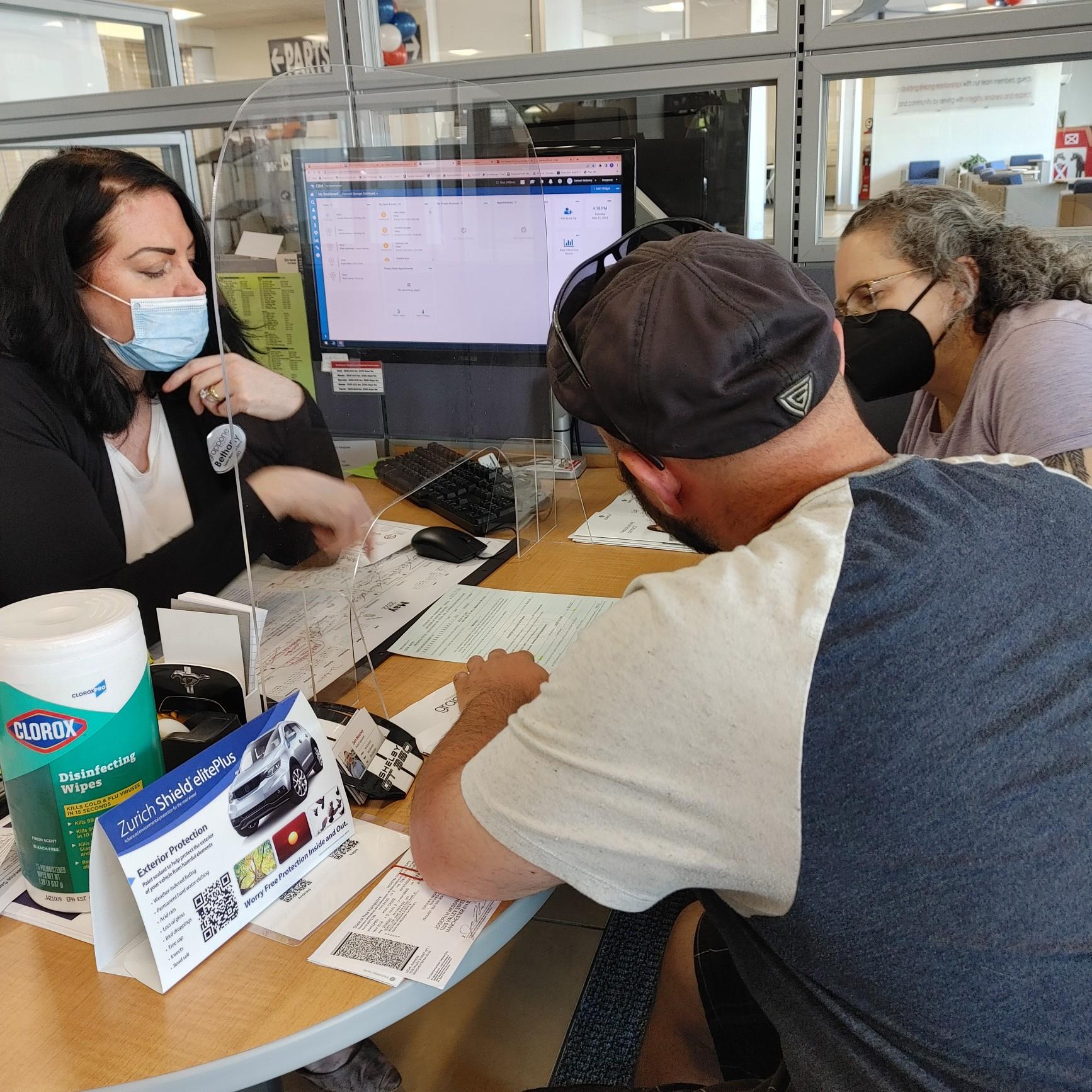 May 21, 2022 - Joe and his mother review a document being explained by Bethany as Joe gets his new car!!