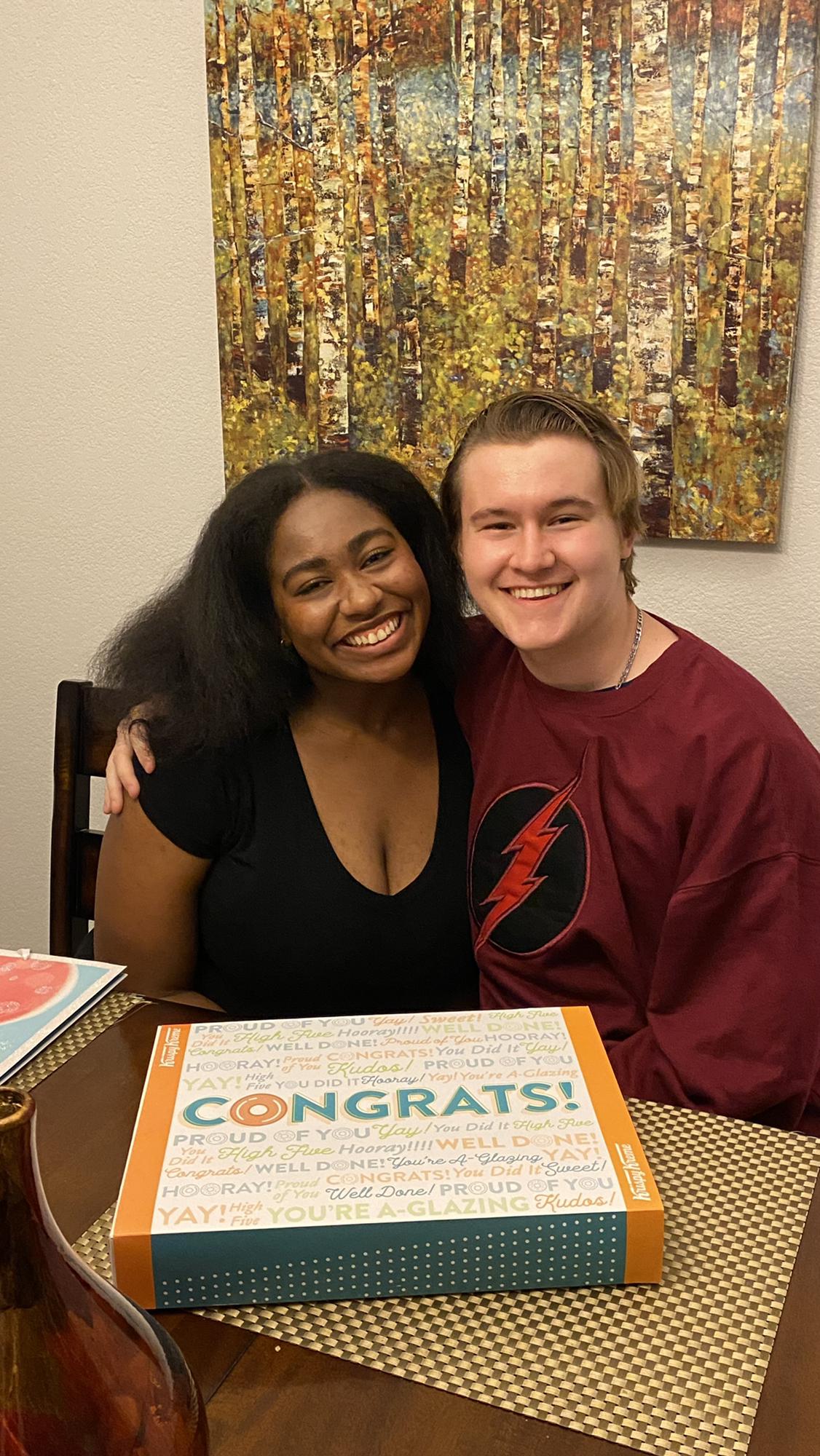 Here's us the day Gunner came home from school! I was so proud of him for graduating! My mom got Krispey Kreme to celebrate, and the congratulating wrapping for the box was perfect!