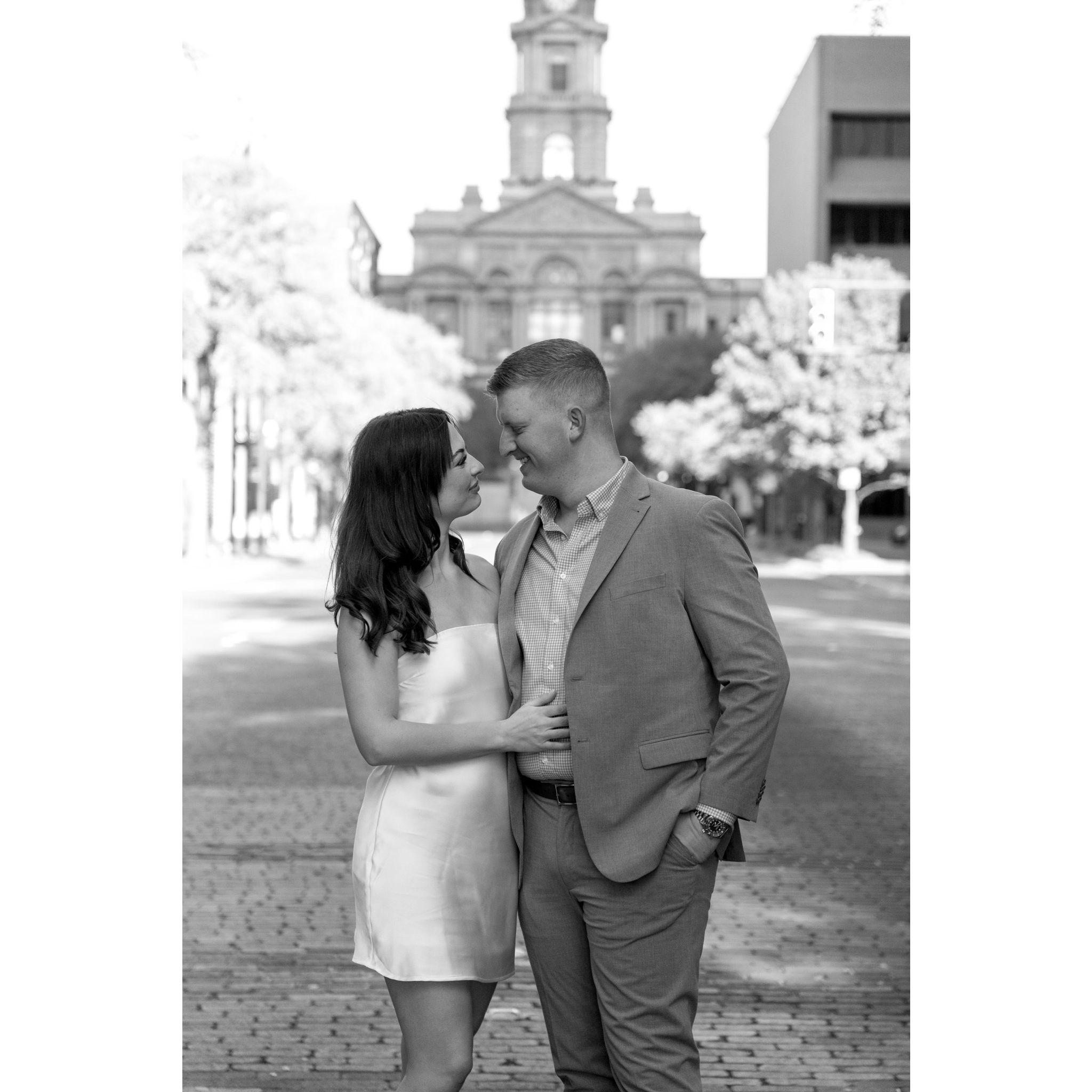 This photo was taken in front of the Fort Worth Courthouse, where we took our engagement photos in December 2024.