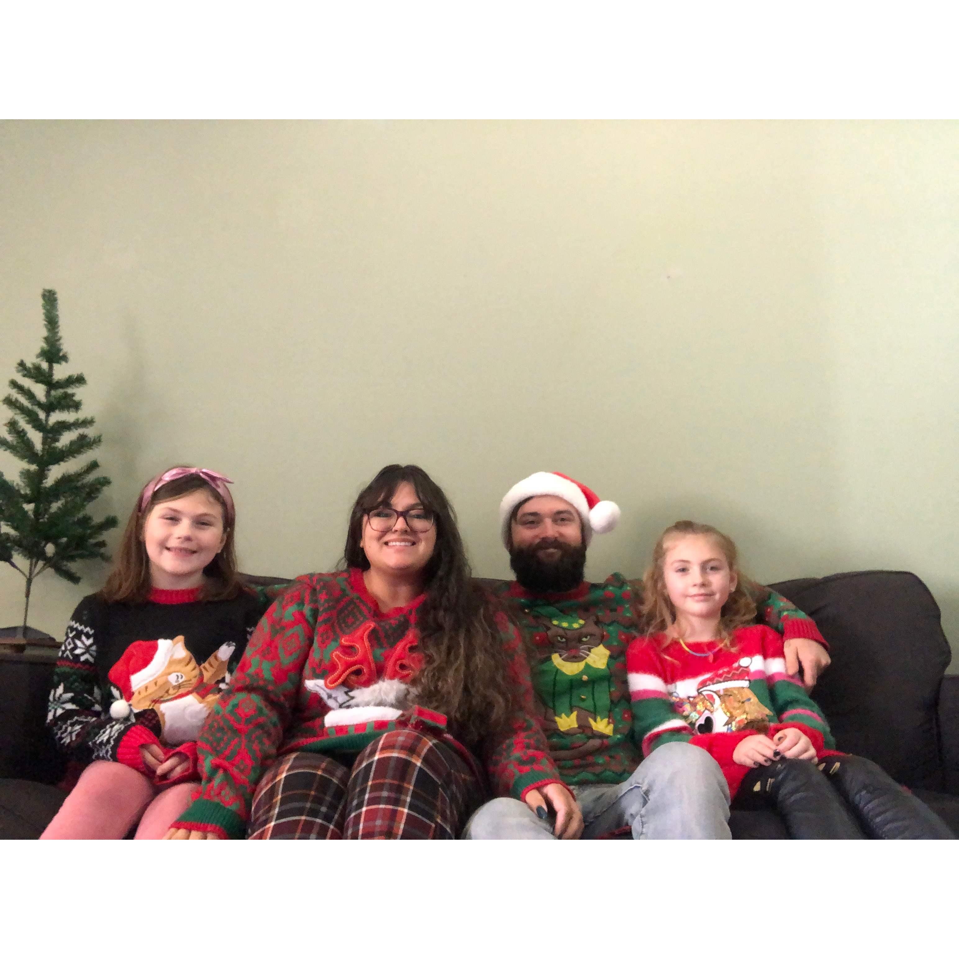 Christmas 2021 ft. our animal-themed sweaters. It was literally 80 outside Christmas morning so this picture was the only time we had these on