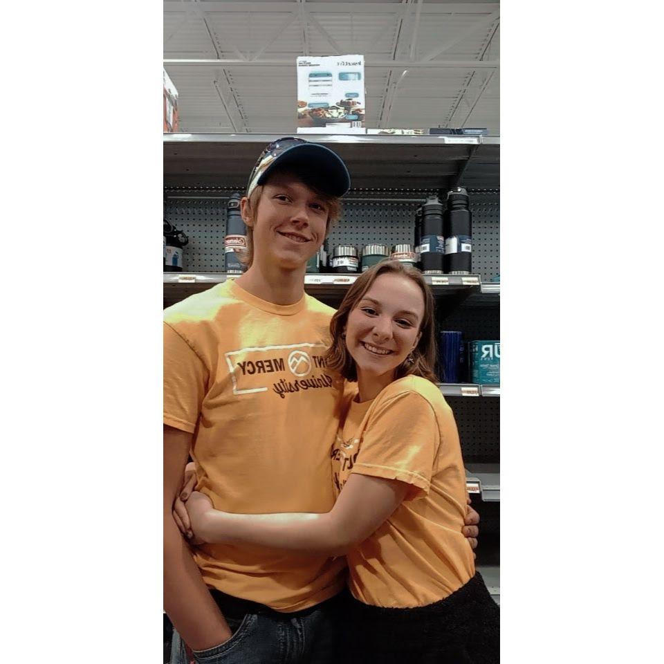 Nathan and Sam sporting their Mount Mercy attire at Nathan's favorite store: Fleet Farm.