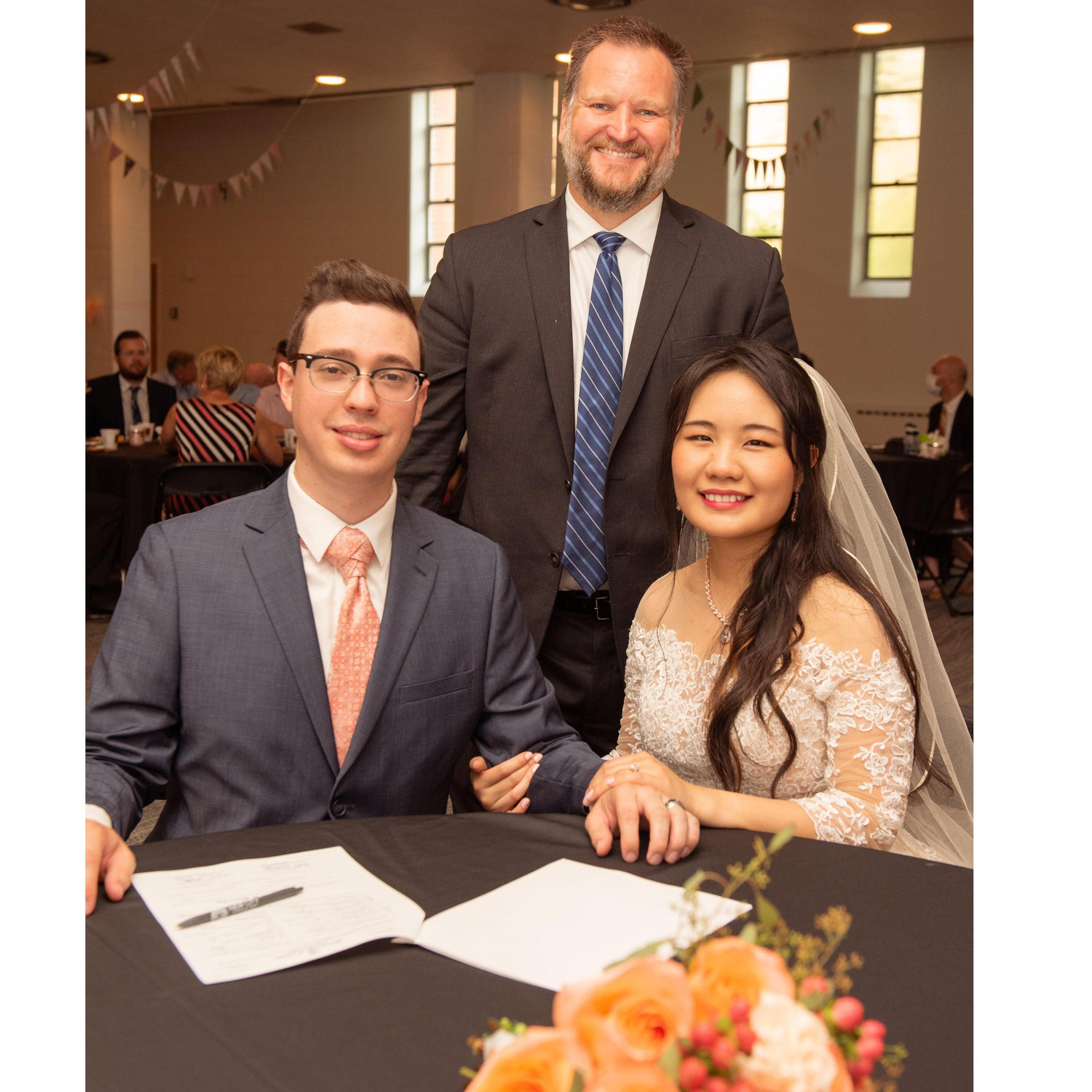signing marriage license with pastor Matt.