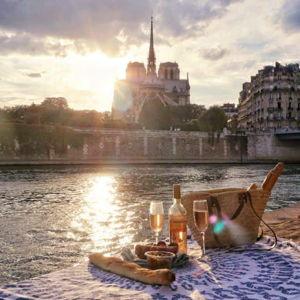 A bottle of wine & baguette by the Seine