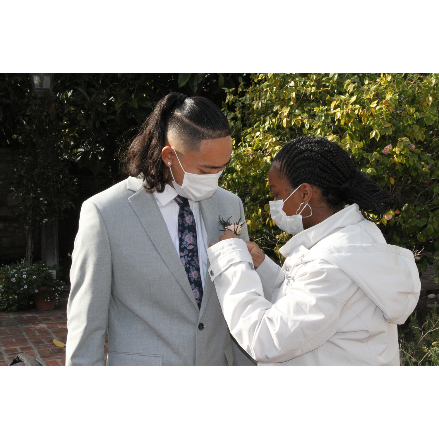 Best Man's boutonniere pinned by Kayla