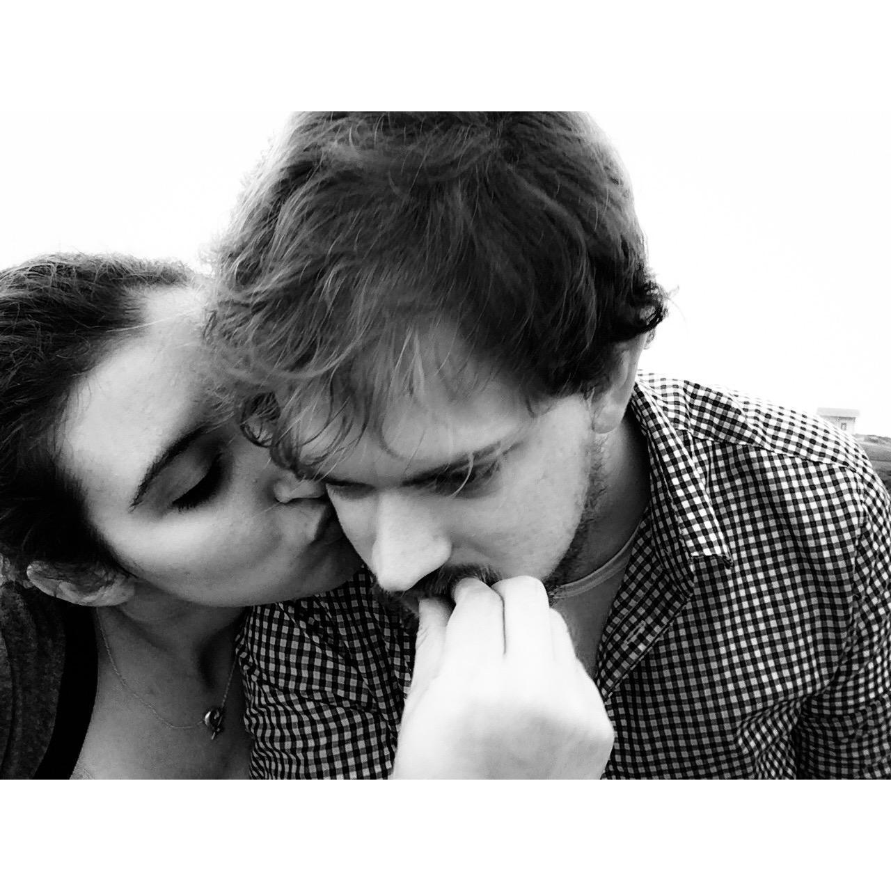 Kel kisses Chris while he tries to peacefully eat an olive (seriously, that is what's happening here). Somewhere in the Bay Area, 2017.