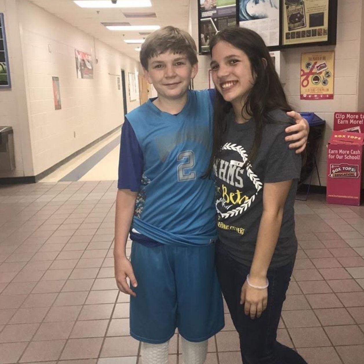 This is the couple's first photo together from seventh grade! They were middle school "boyfriend and girlfriend," but nothing serious yet. They definitely had big fat crushes on each other though!