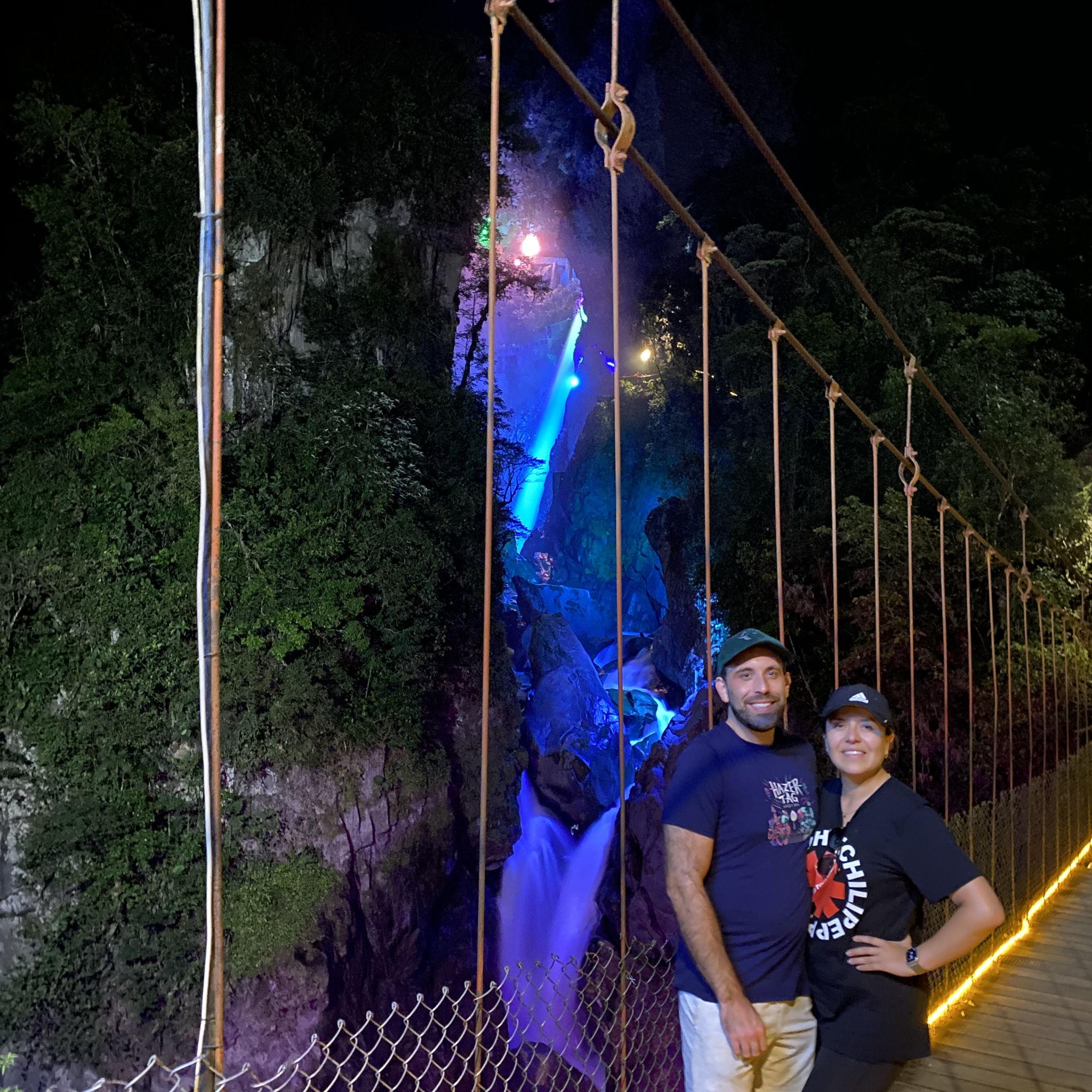Baños de Agua Santa - Pailón del Diablo: Michael and Vanessa enjoying the illuminated waterfall after sharing a glass of wine.