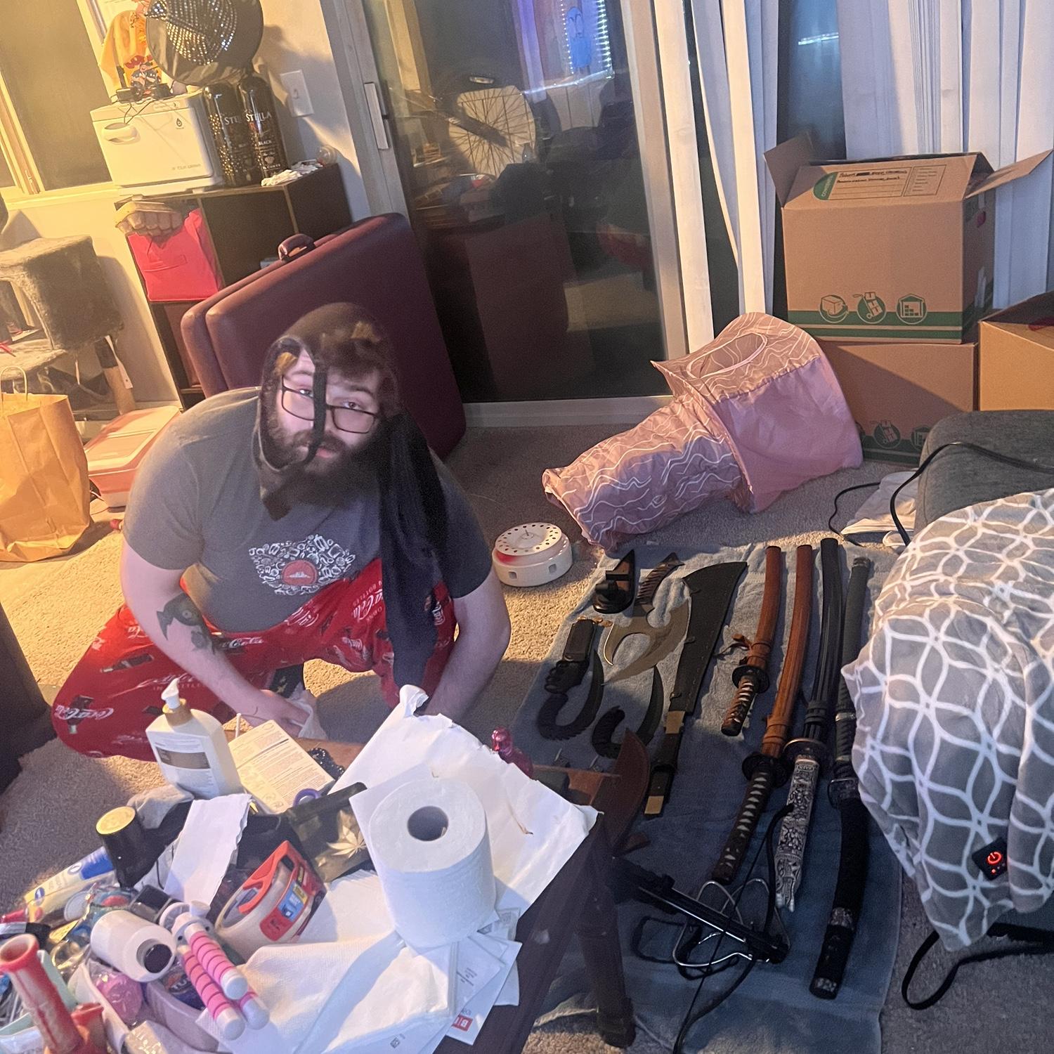 Jenni came home from work to find Robert cleaning his Grandpas swords, after putting laundry away so he was still wearing my bra on his head because titties.