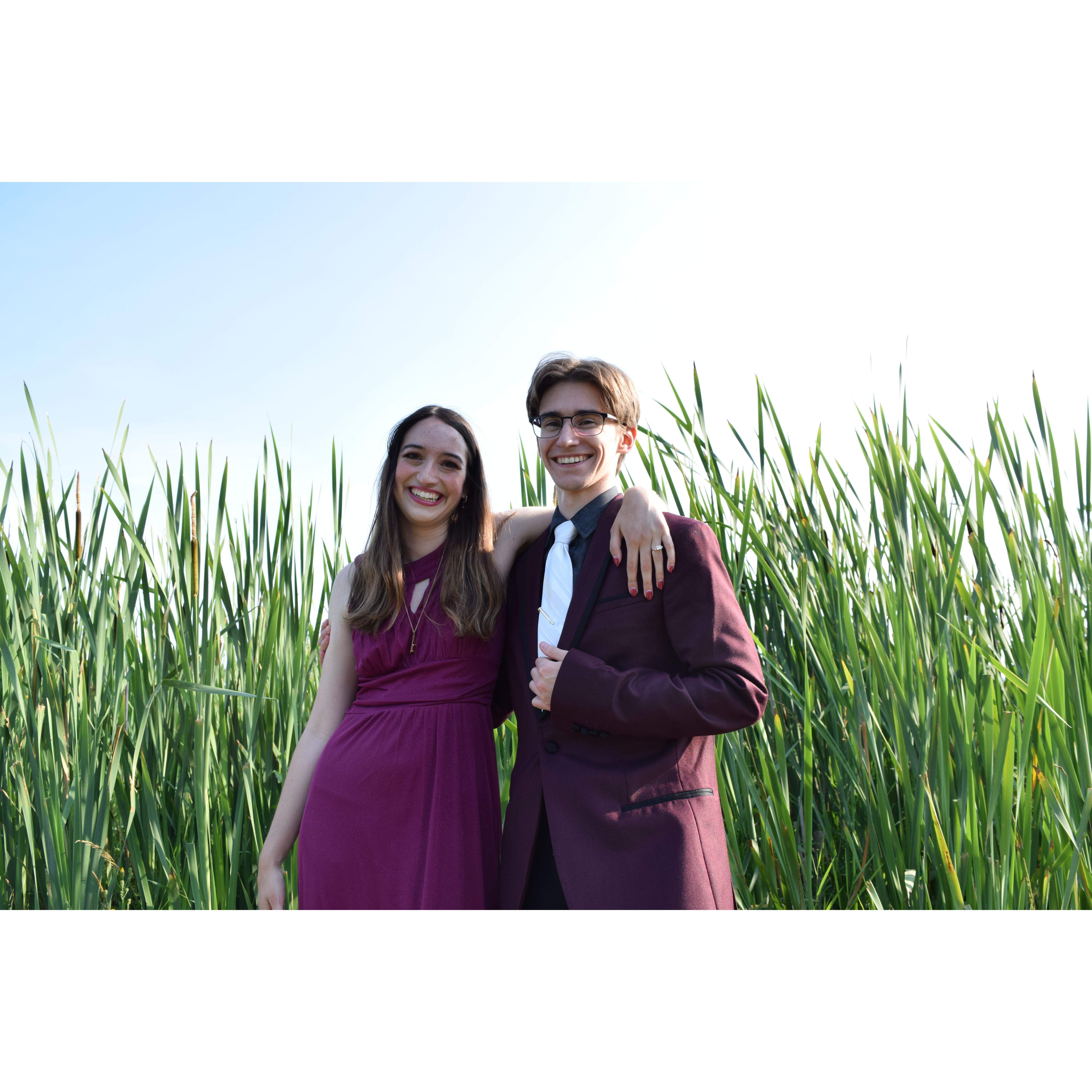 us standing in front of grass